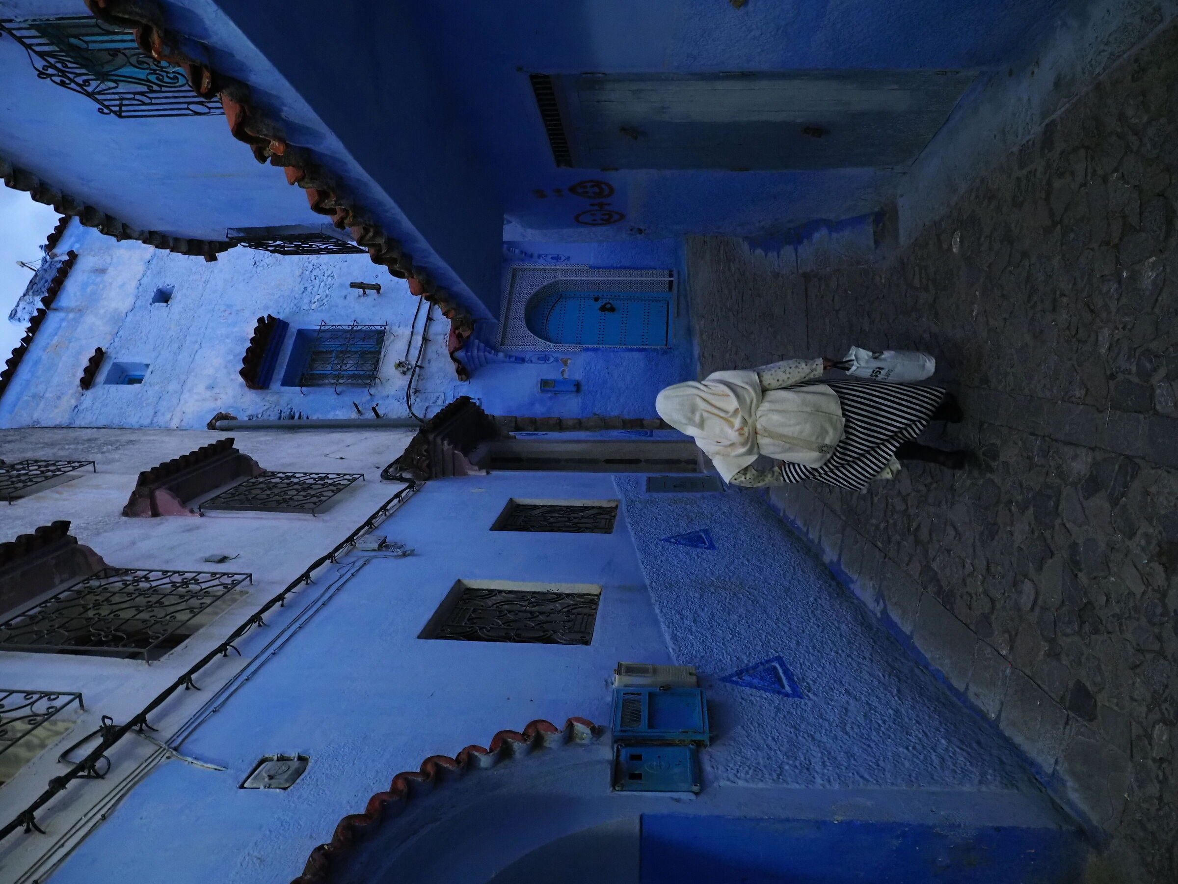 Woman in white in Chefchauen