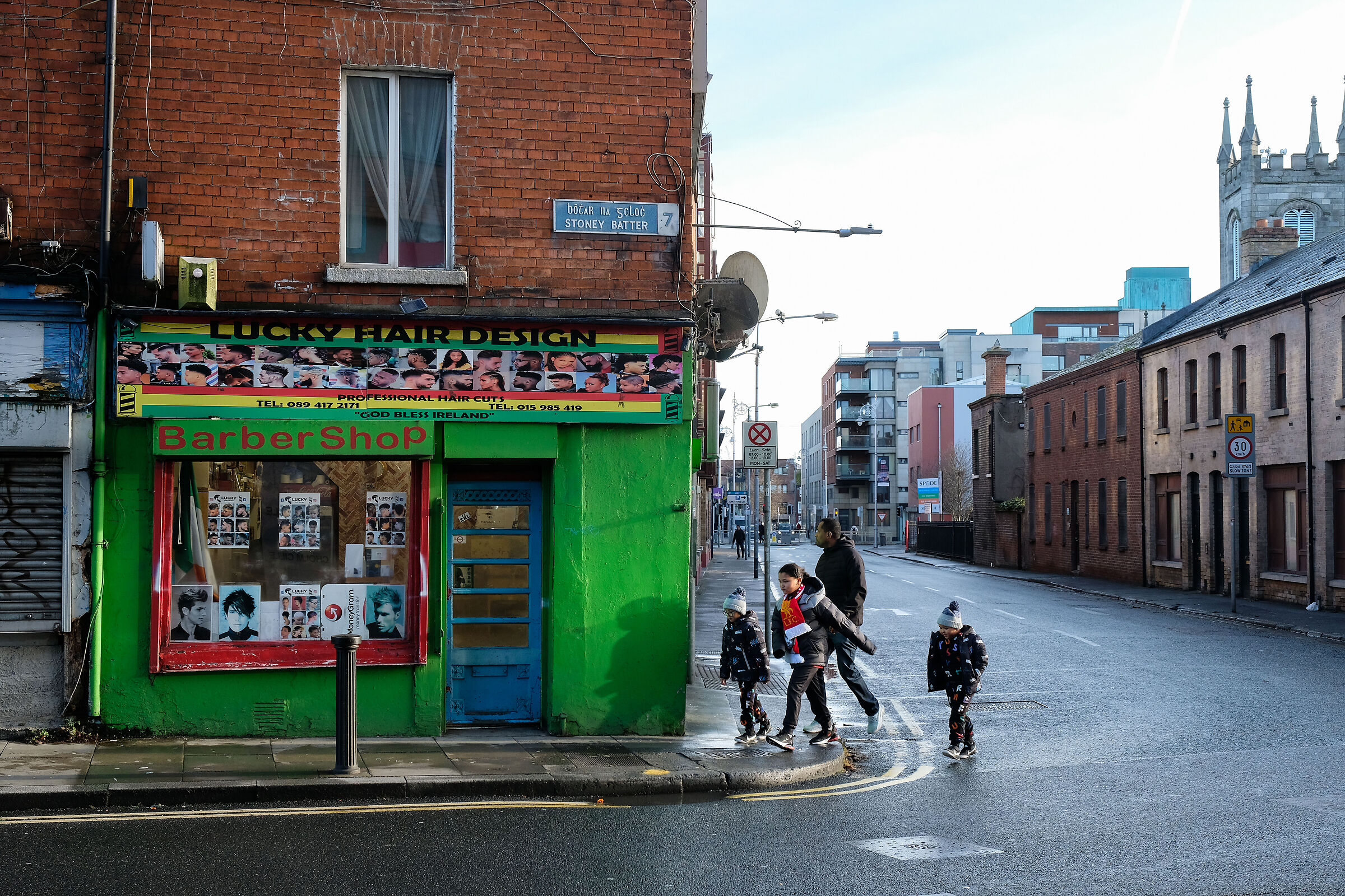 Father and sons go to barber shop