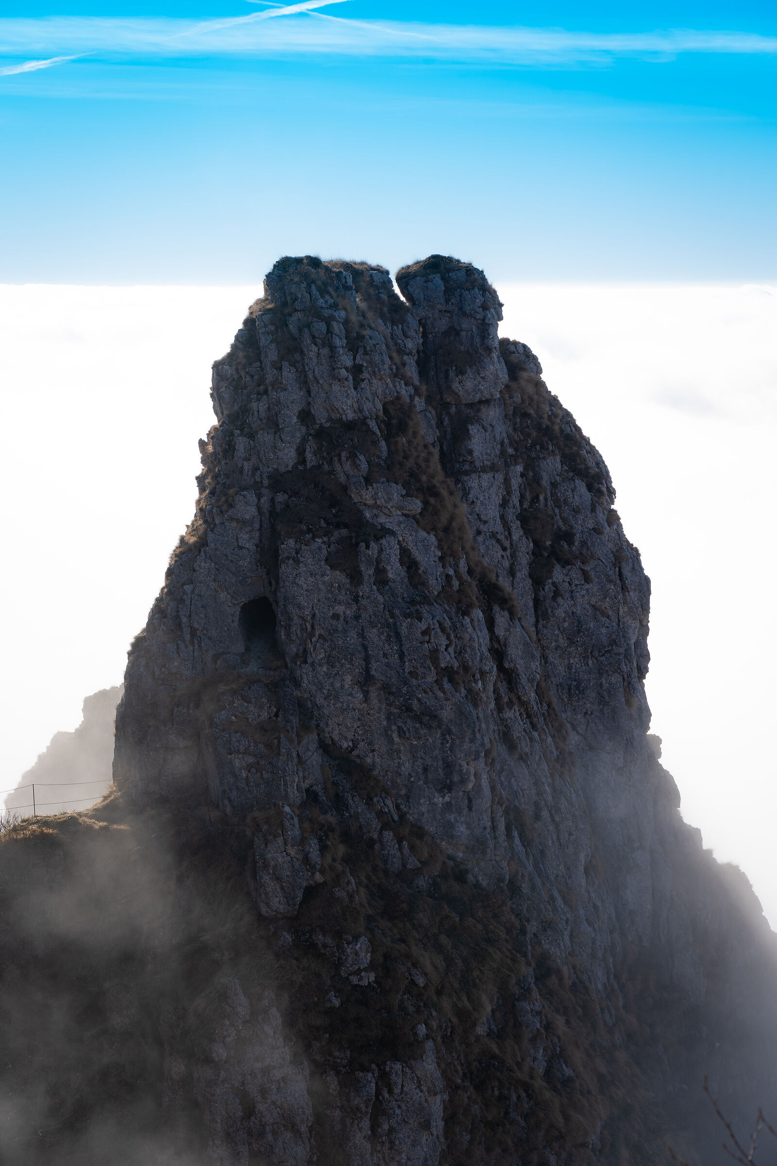 Protrudes from the clouds