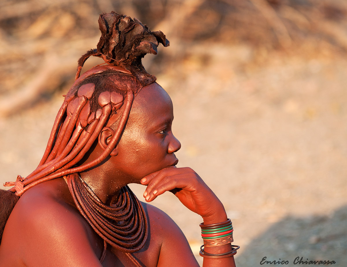 Himba woman in thought ...