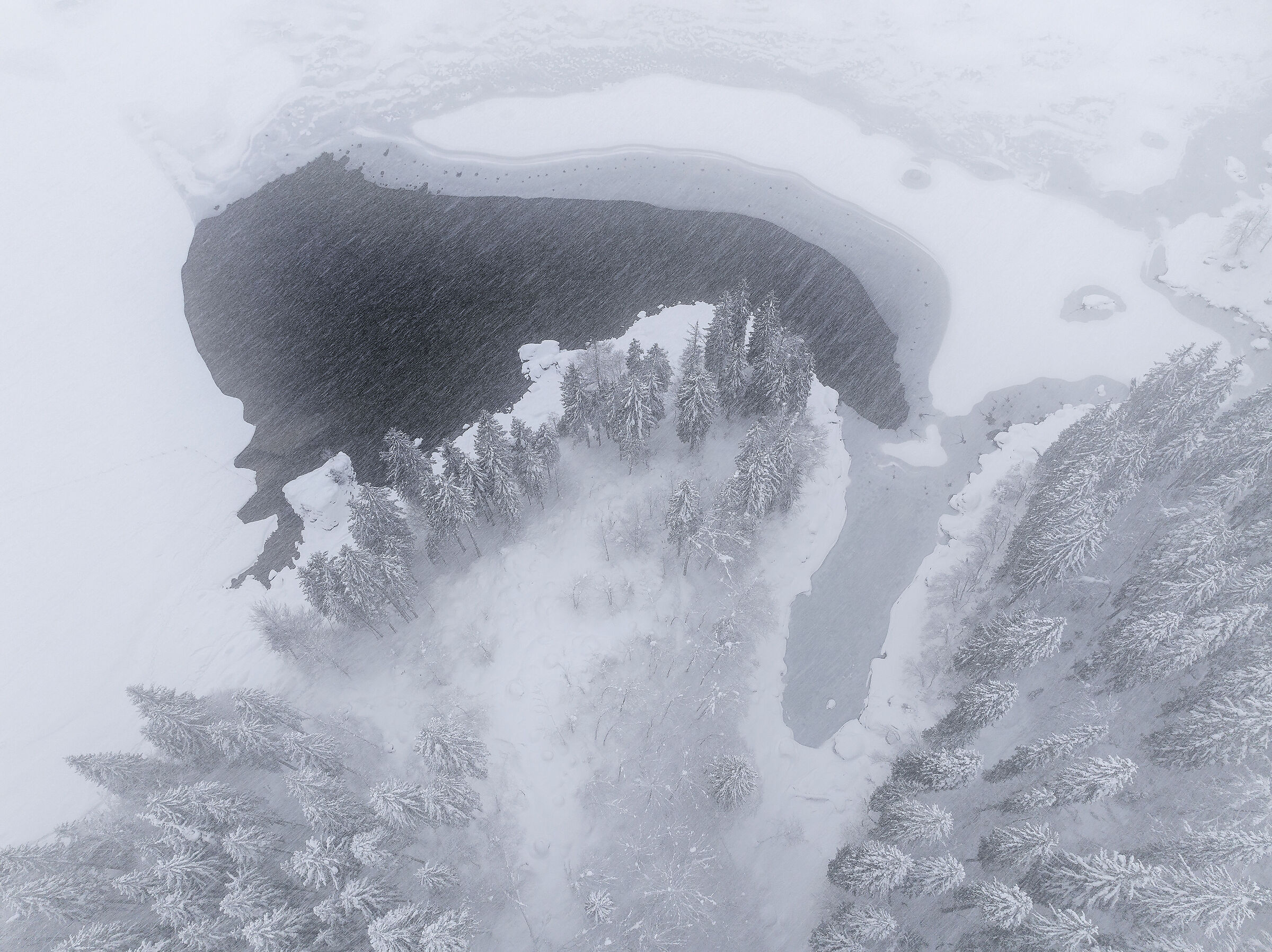 Fusine lake during a snowstorm