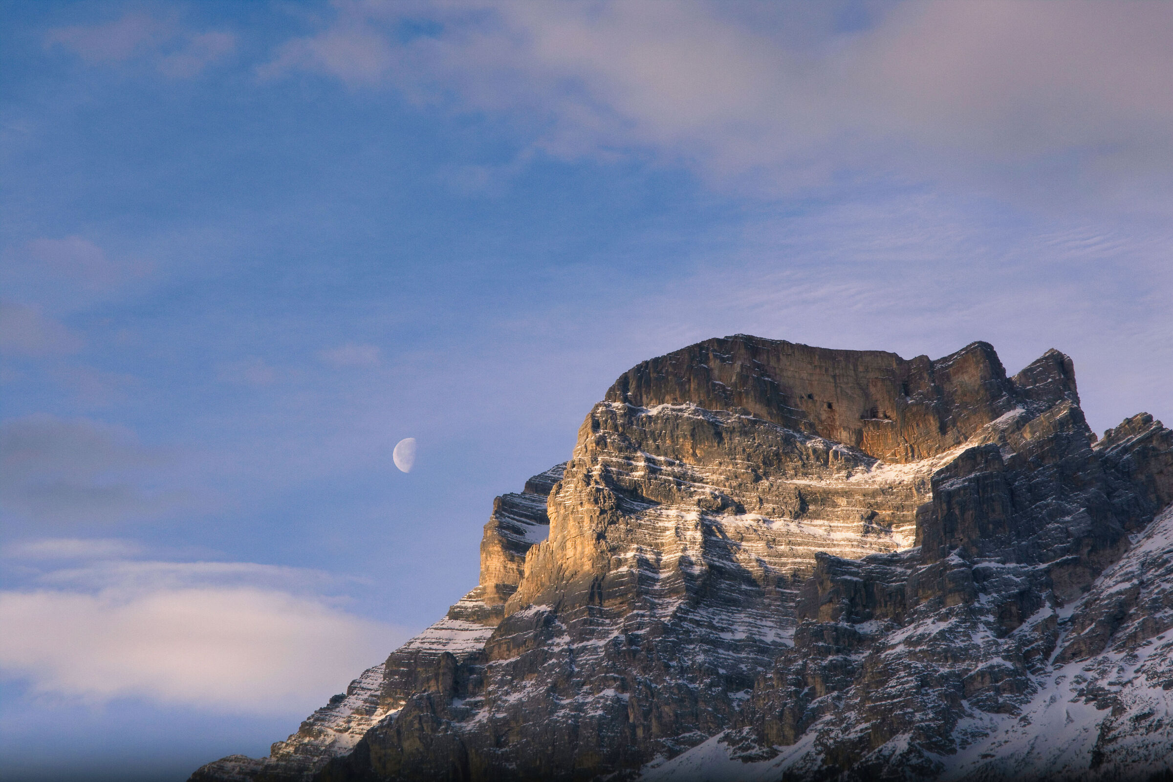 The moon sets behind the Pelmo