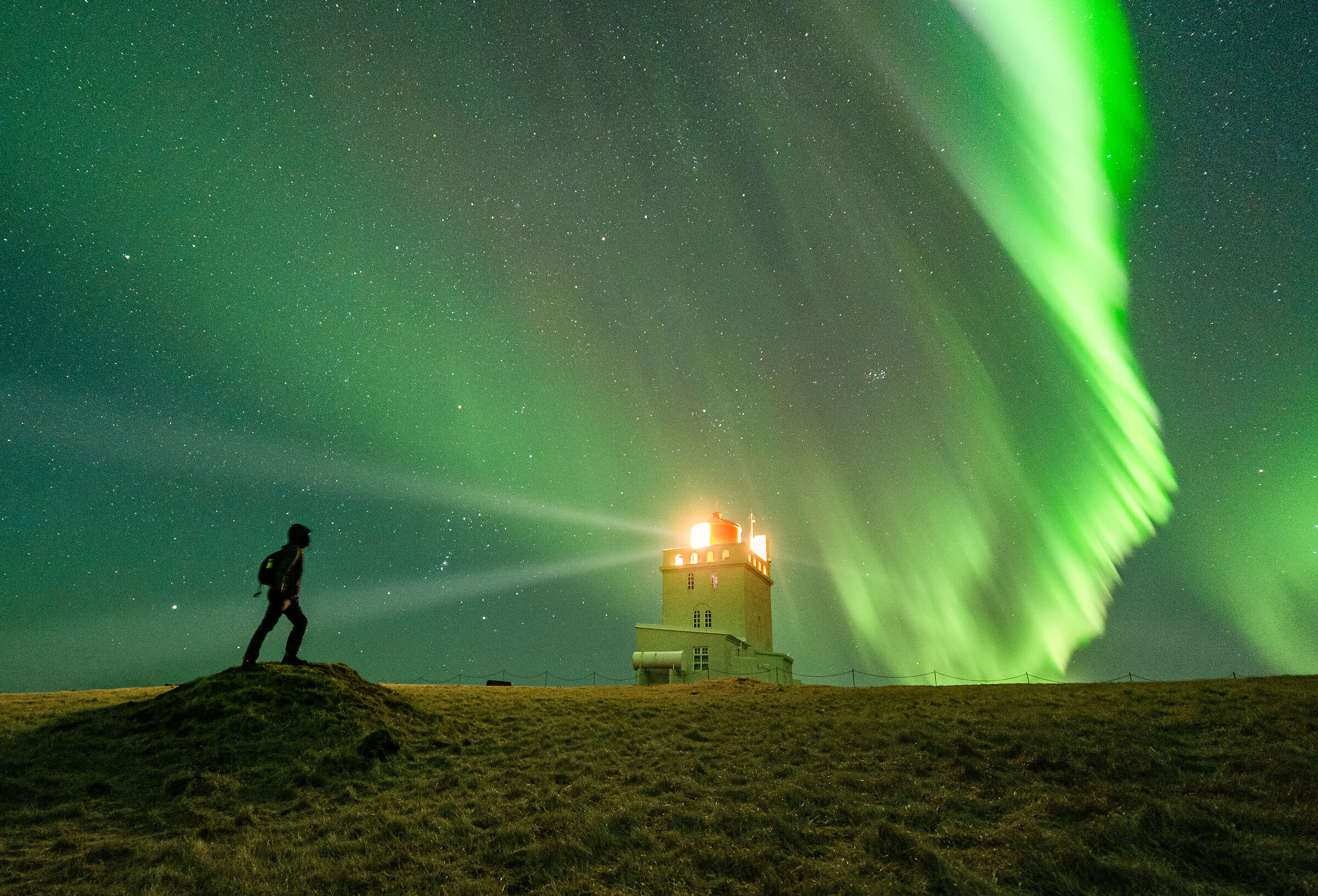 The man, the lighthouse and the dawn