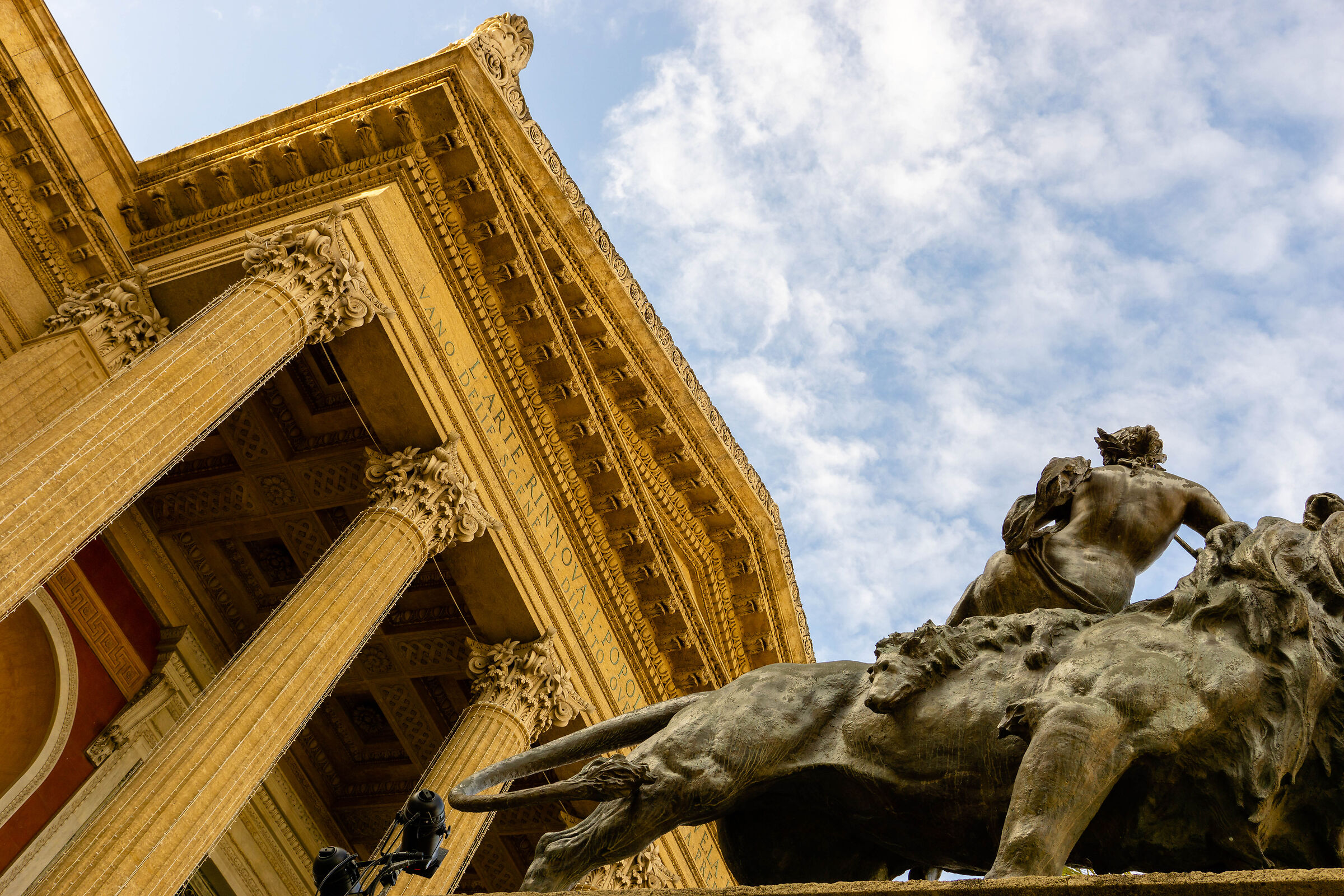 The clouds, the bronze, the stone, the sky