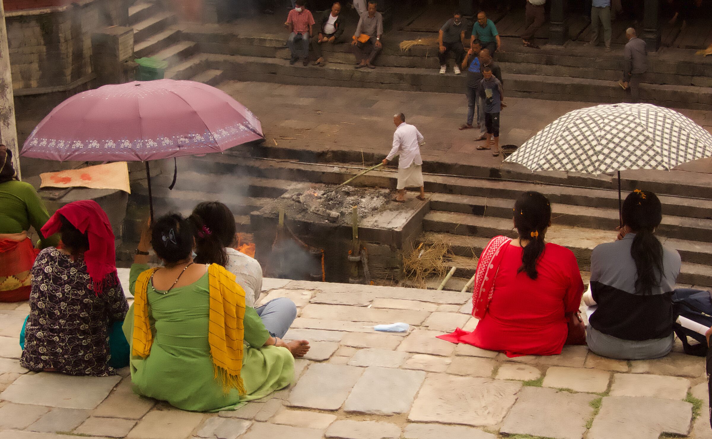 Faithful and perhaps relatives attend cremation