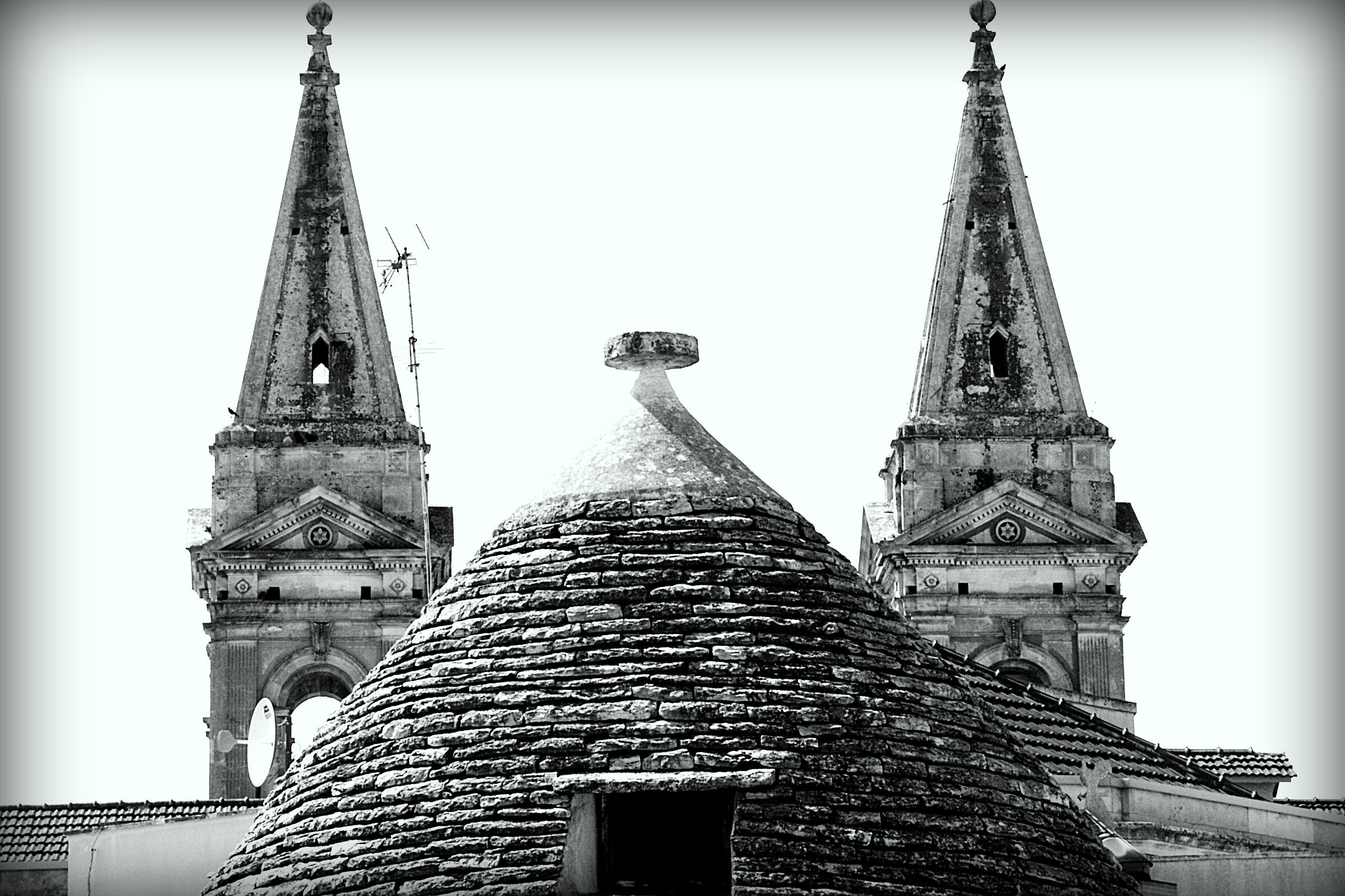 Trullo "escorted" by two bell towers