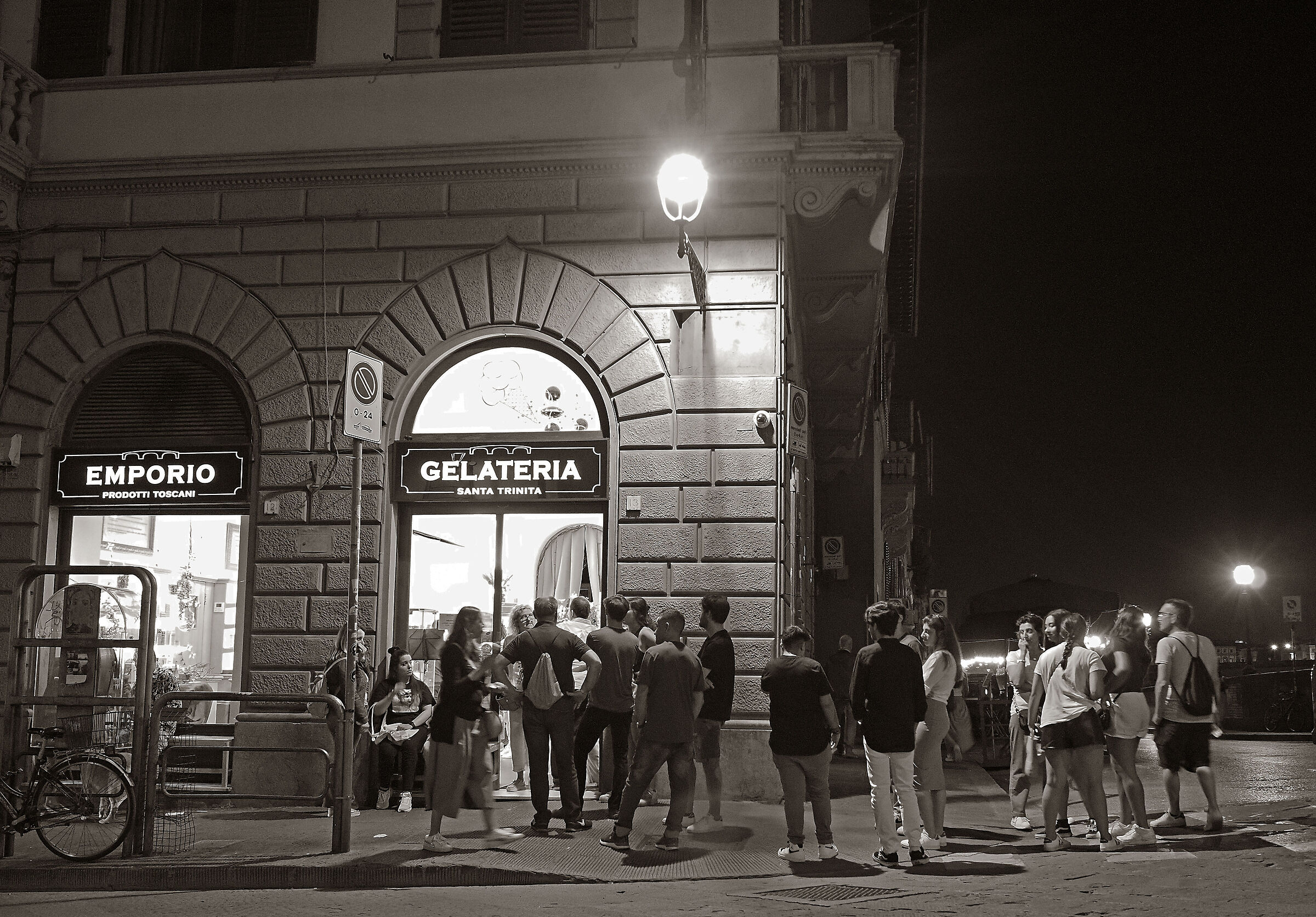 Ice cream parlour at night with queue