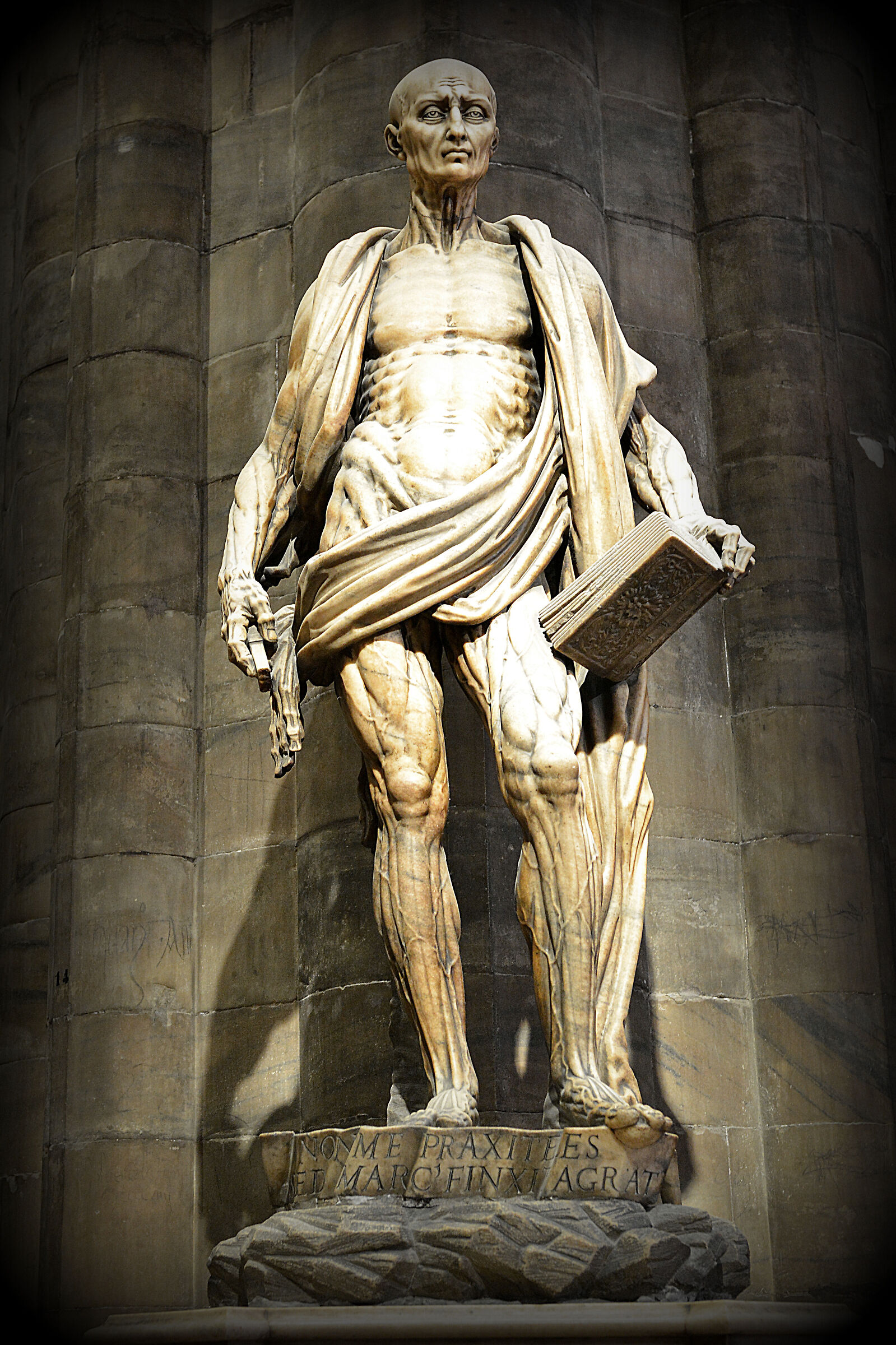 Cathedral. Statue of St. Bartholomew decorticated