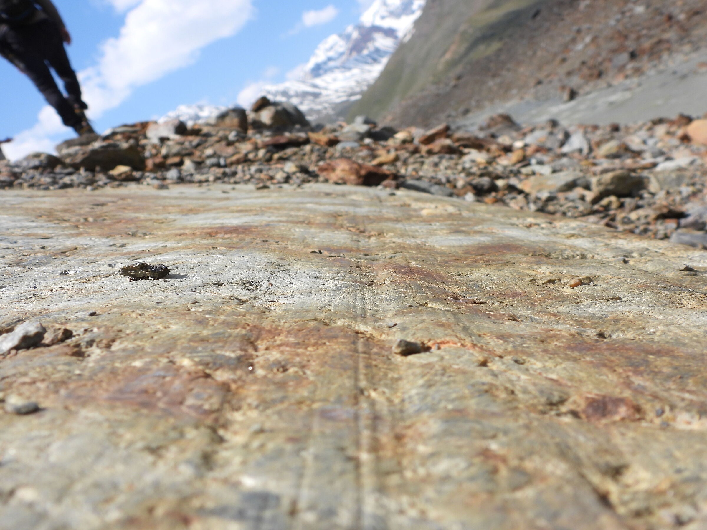 Glacial streaks on a rock in front of the glacier of
