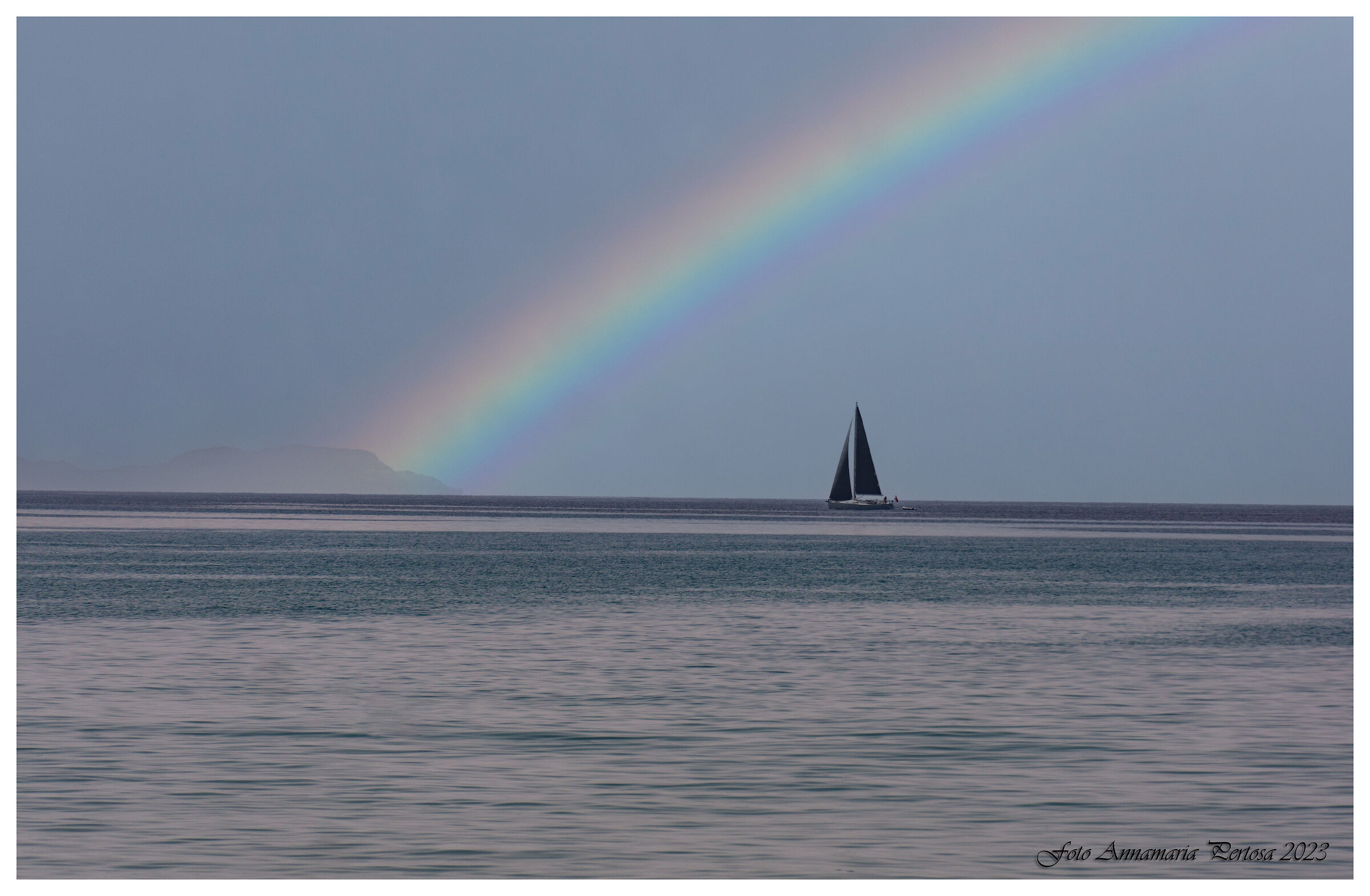 On the horizon a black sail in the sea of Paleokastrizia