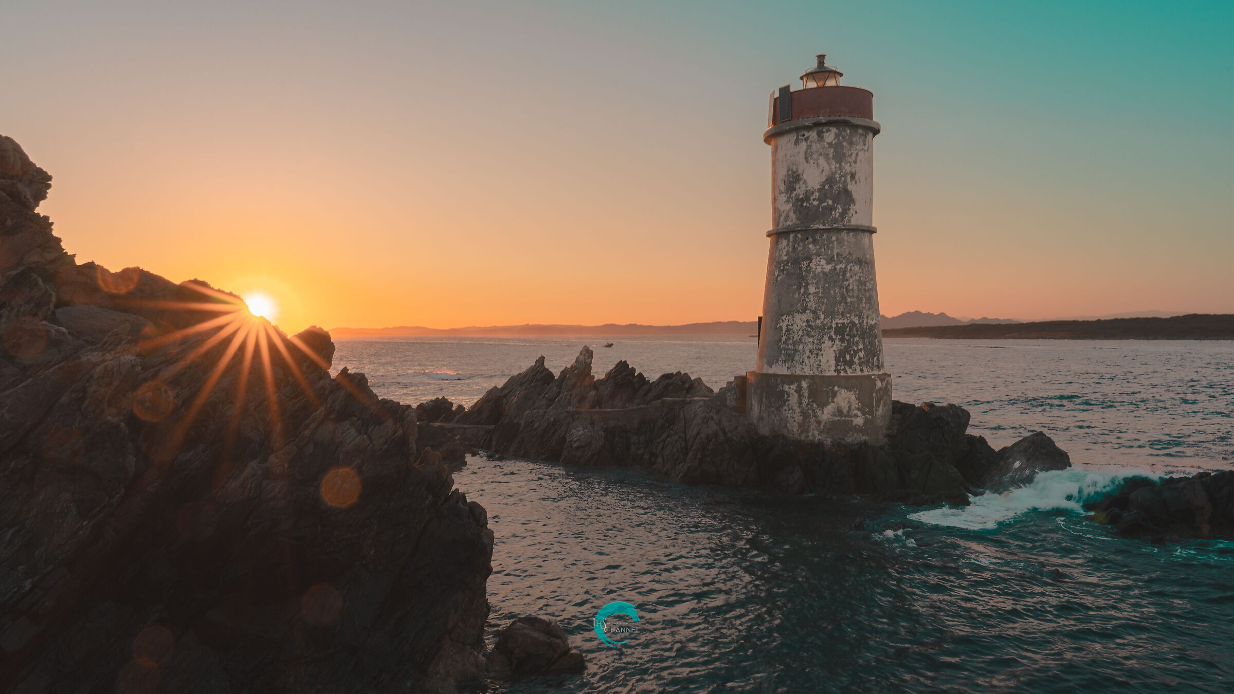 The traffic light of the Capo Ferro Lighthouse at sunset
