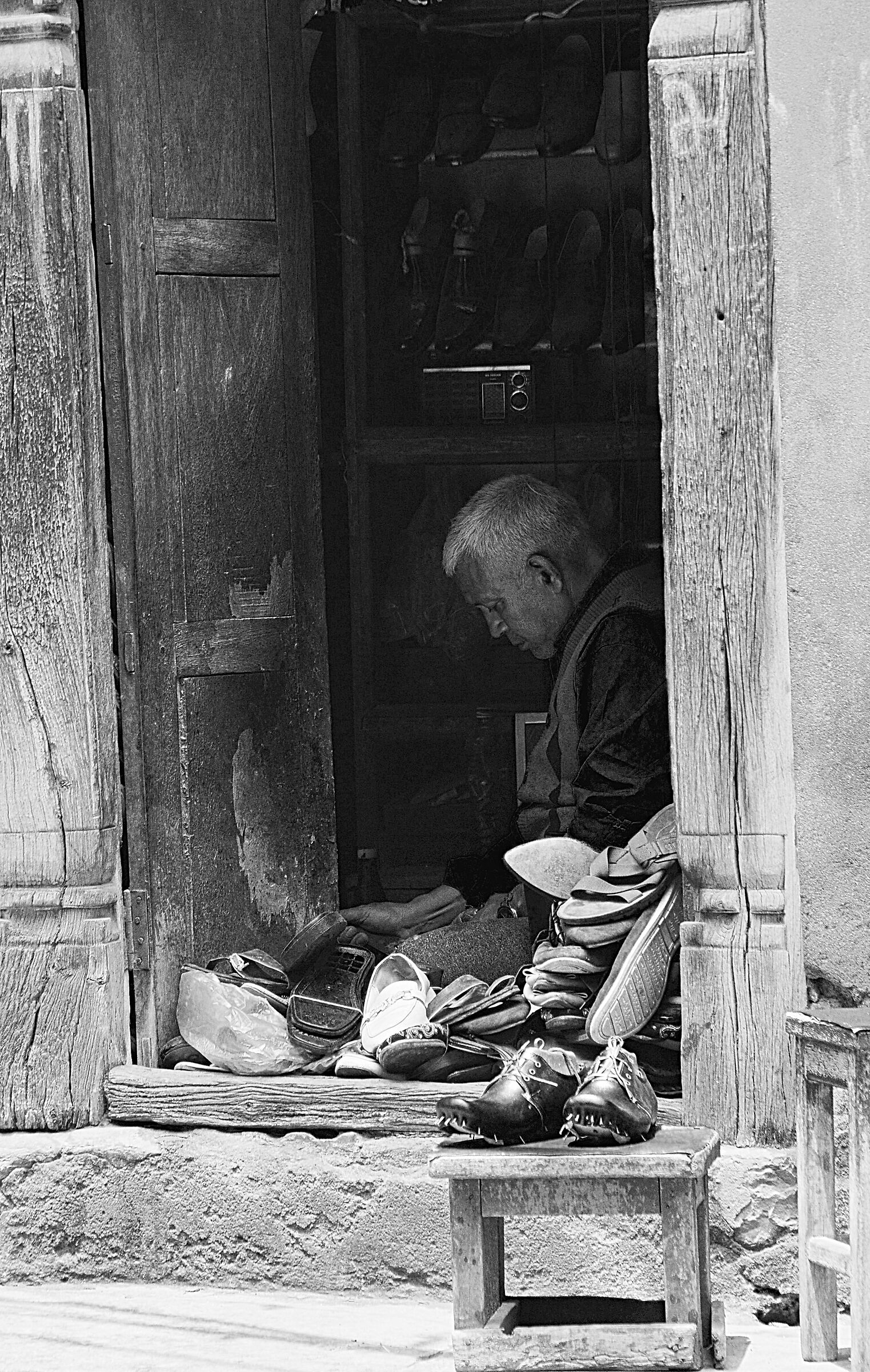 Shoemaker in his shop