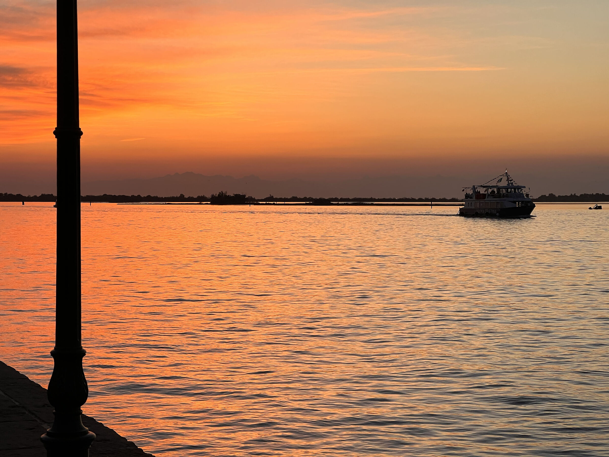 molo di grado al tramonto