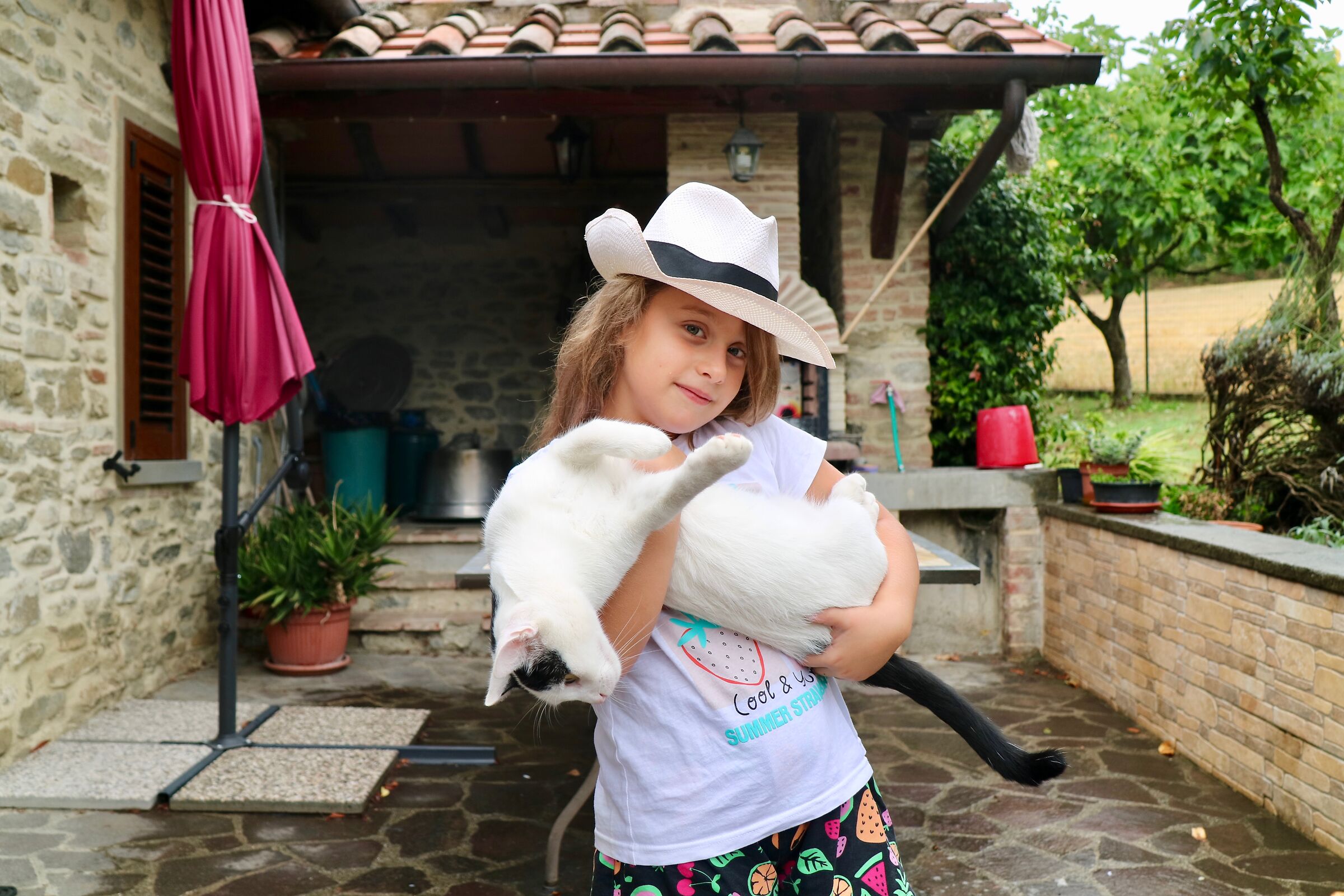 The little girl with the borsalino.
