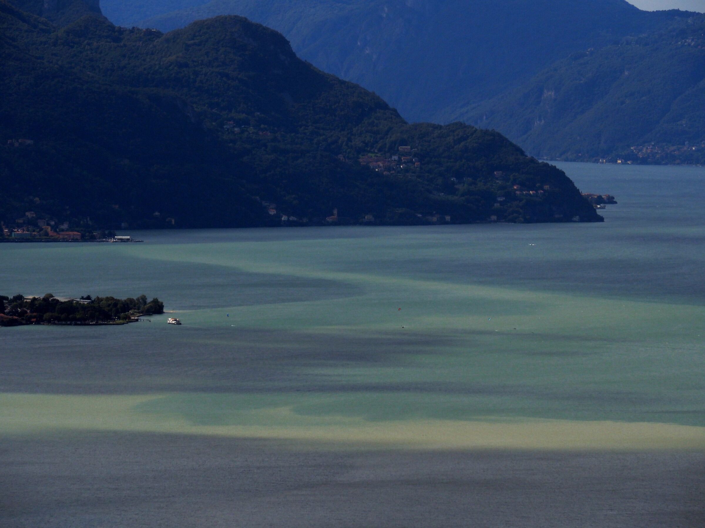 After days of rain strange colors on Lake Como