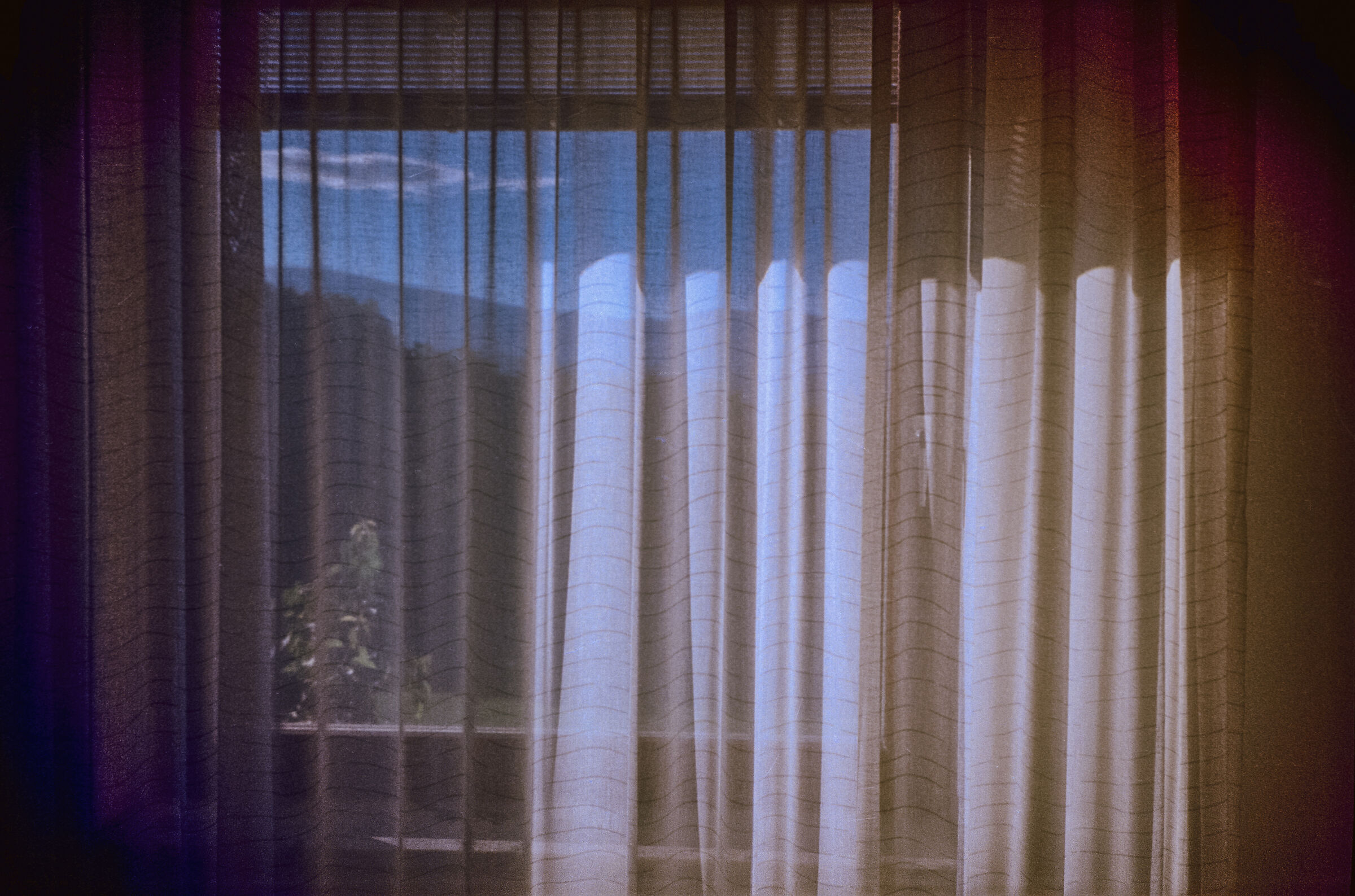 Sun on the window with curtain