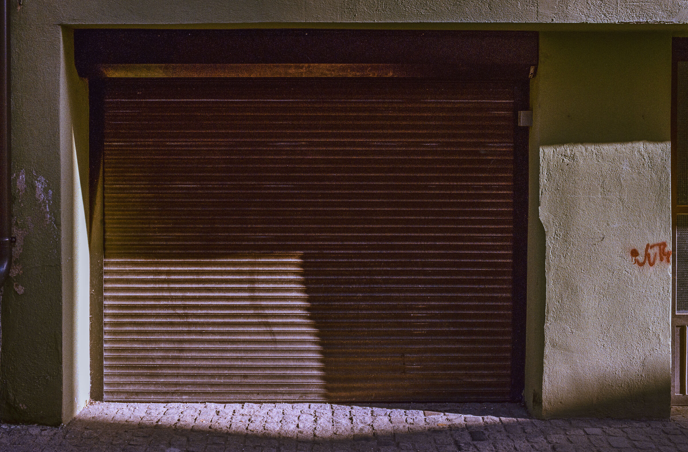 Shadows on an old roller shutter