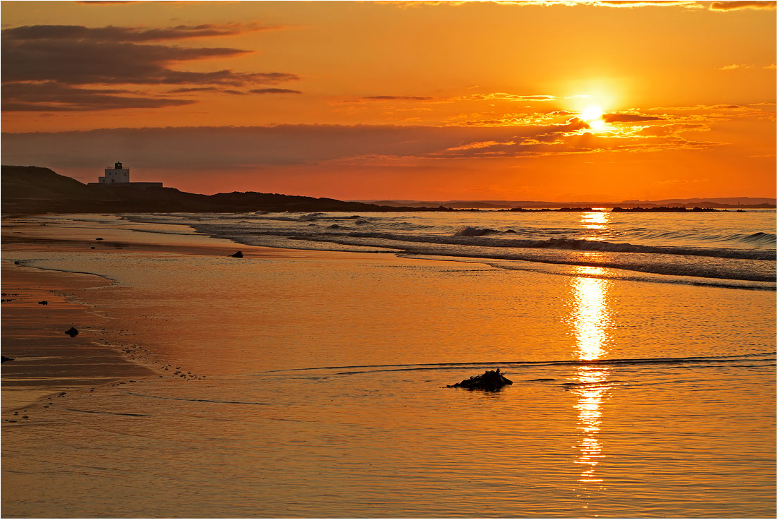 Bamburgh beach and lighthouse