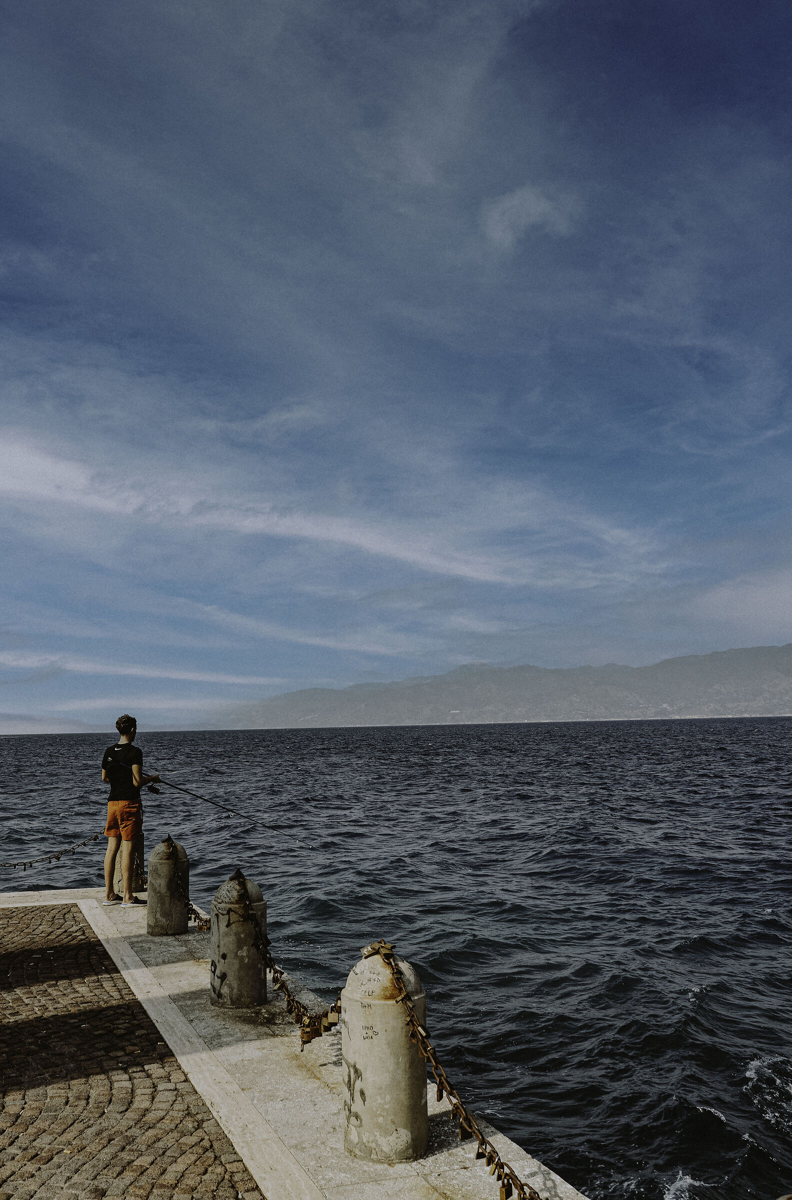 Fisherman on the pier in Reggio Calabria