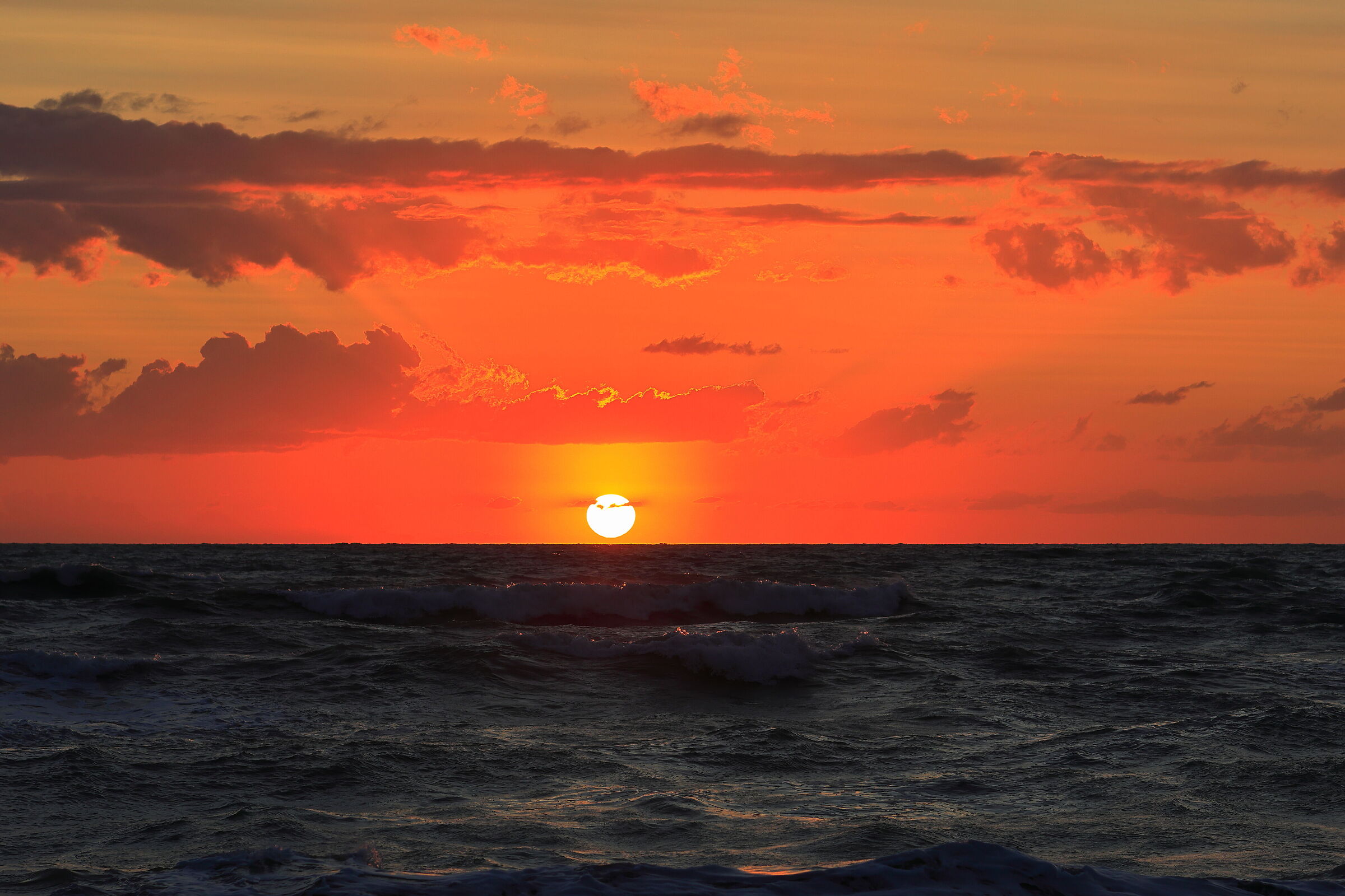 Sunset over rough seas