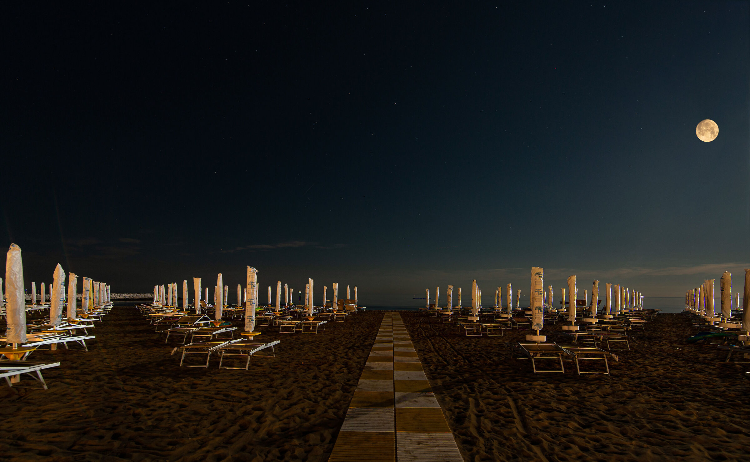 Summer on a solitary beach + full moon