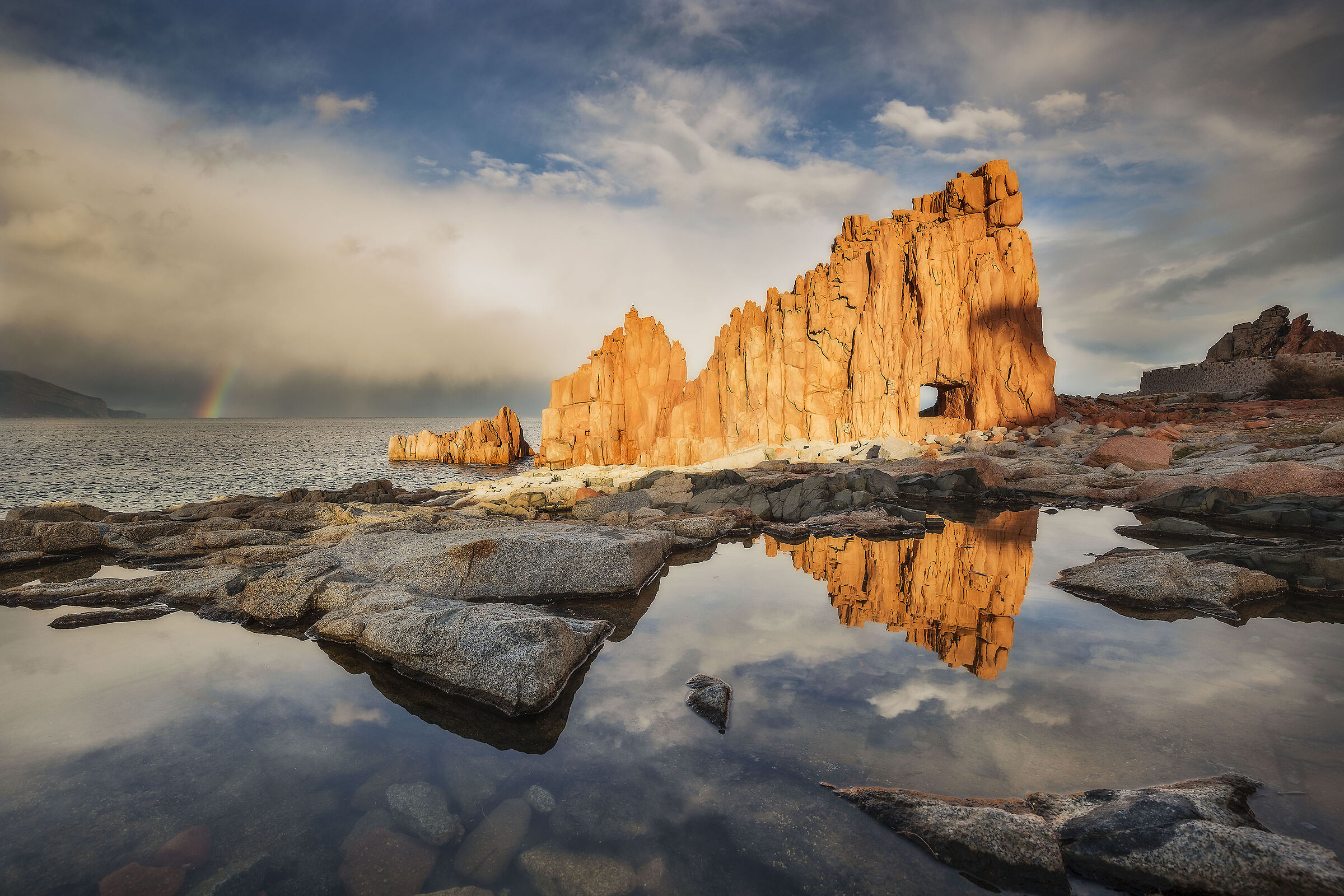 Shy rainbow at the Red Rocks of Arbatax