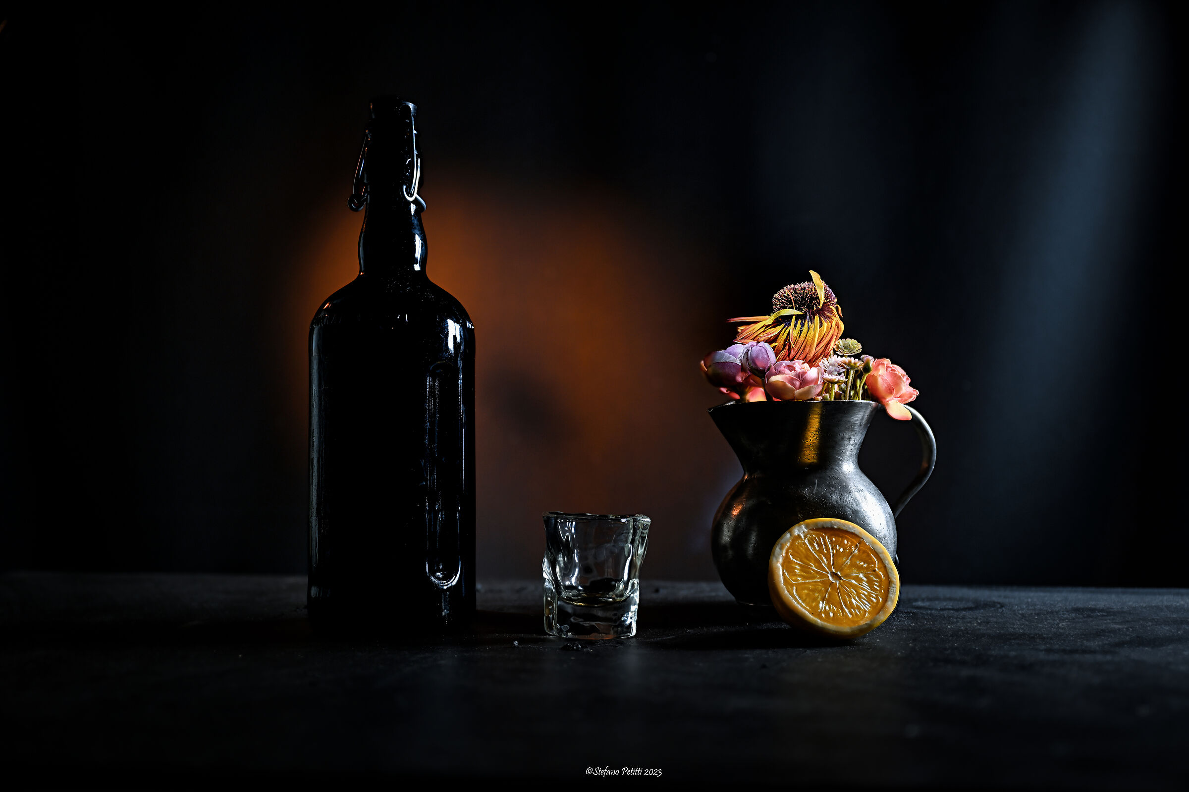 Bottle, glass & flower