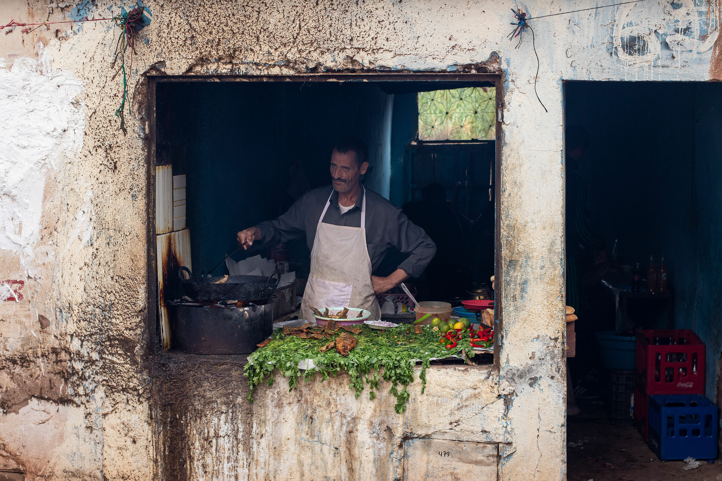 Man cooking in food market