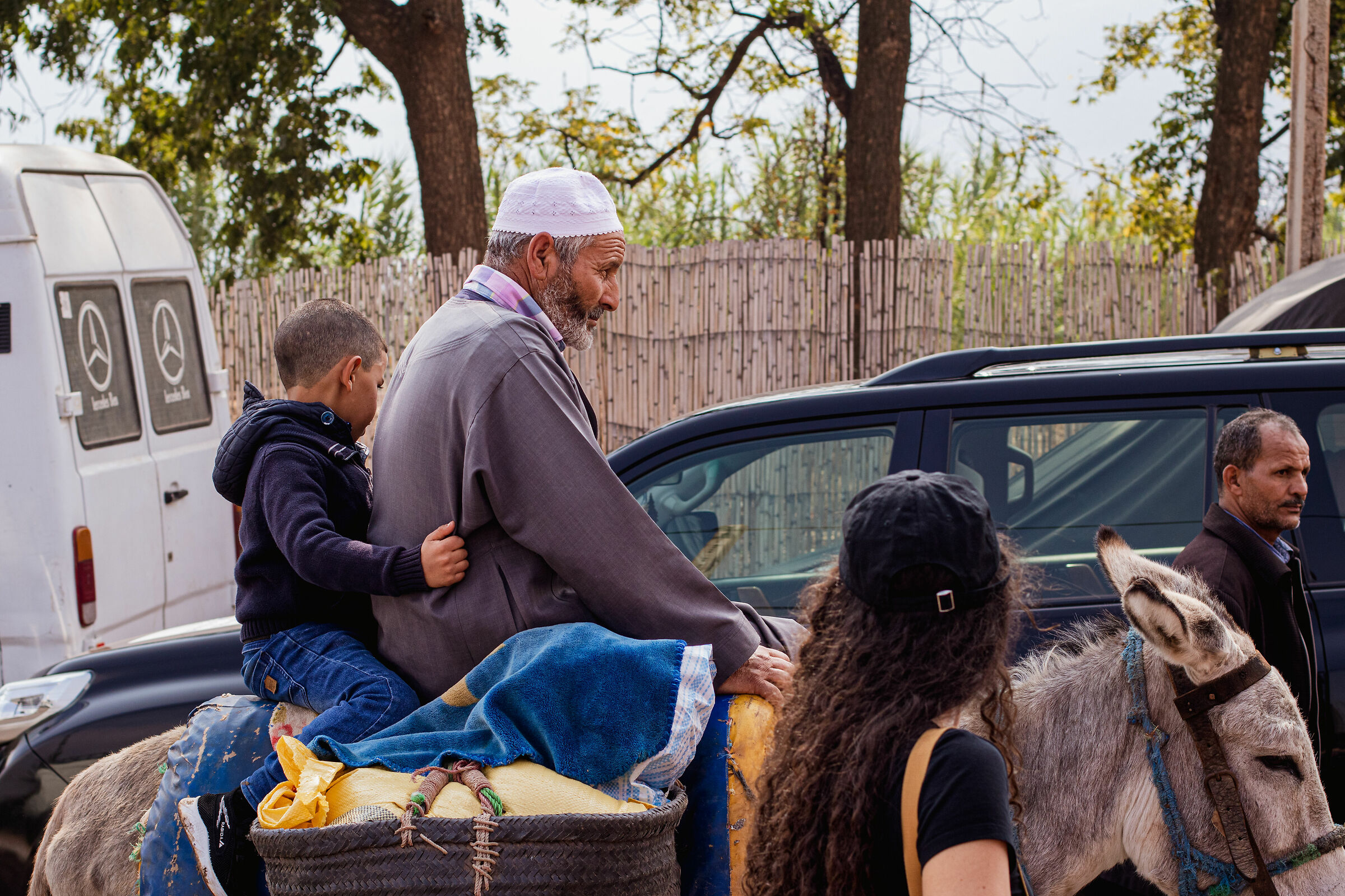 Man with child riding a donkey