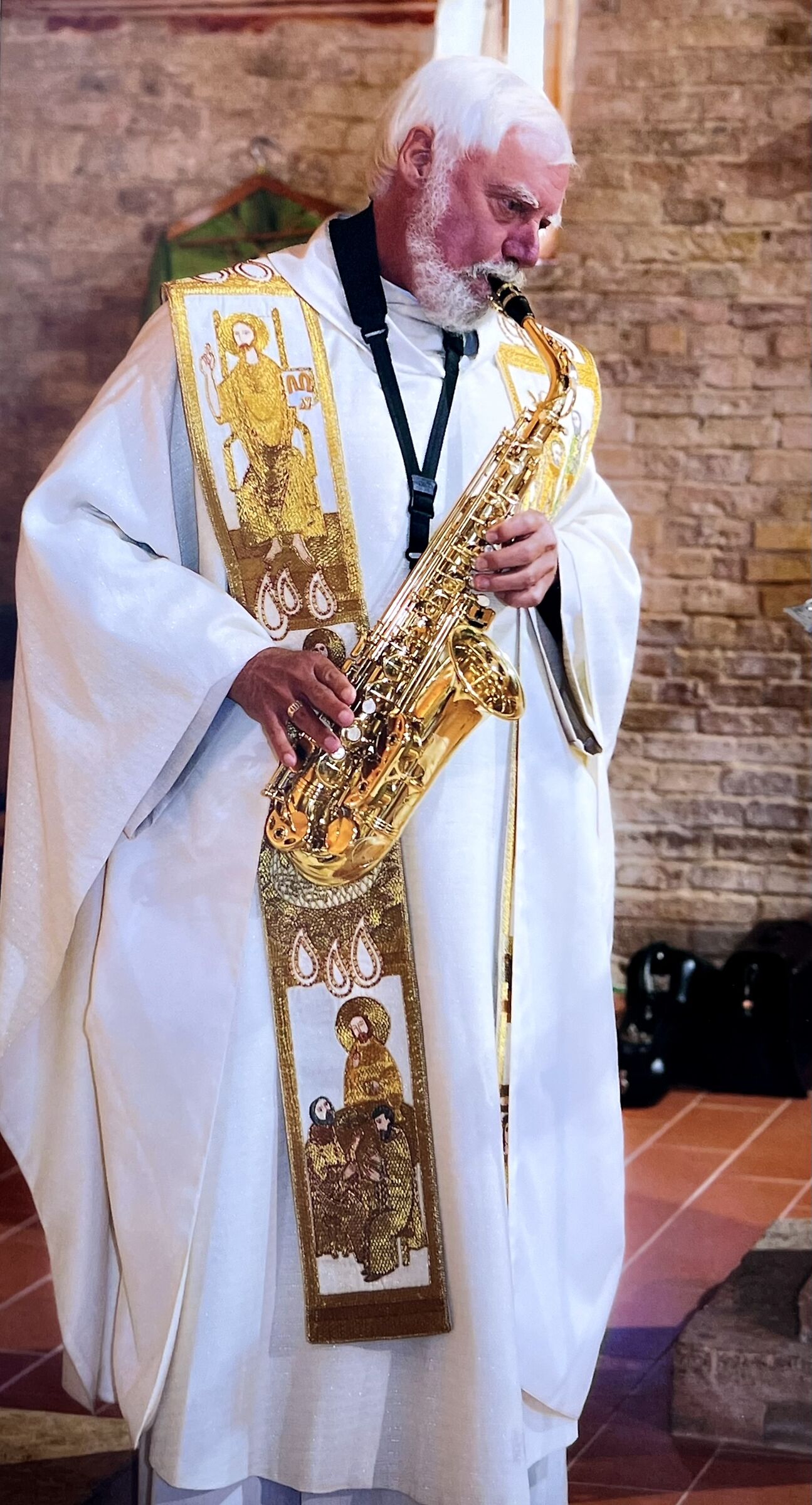Instead of preaching, the priest plays the sax!