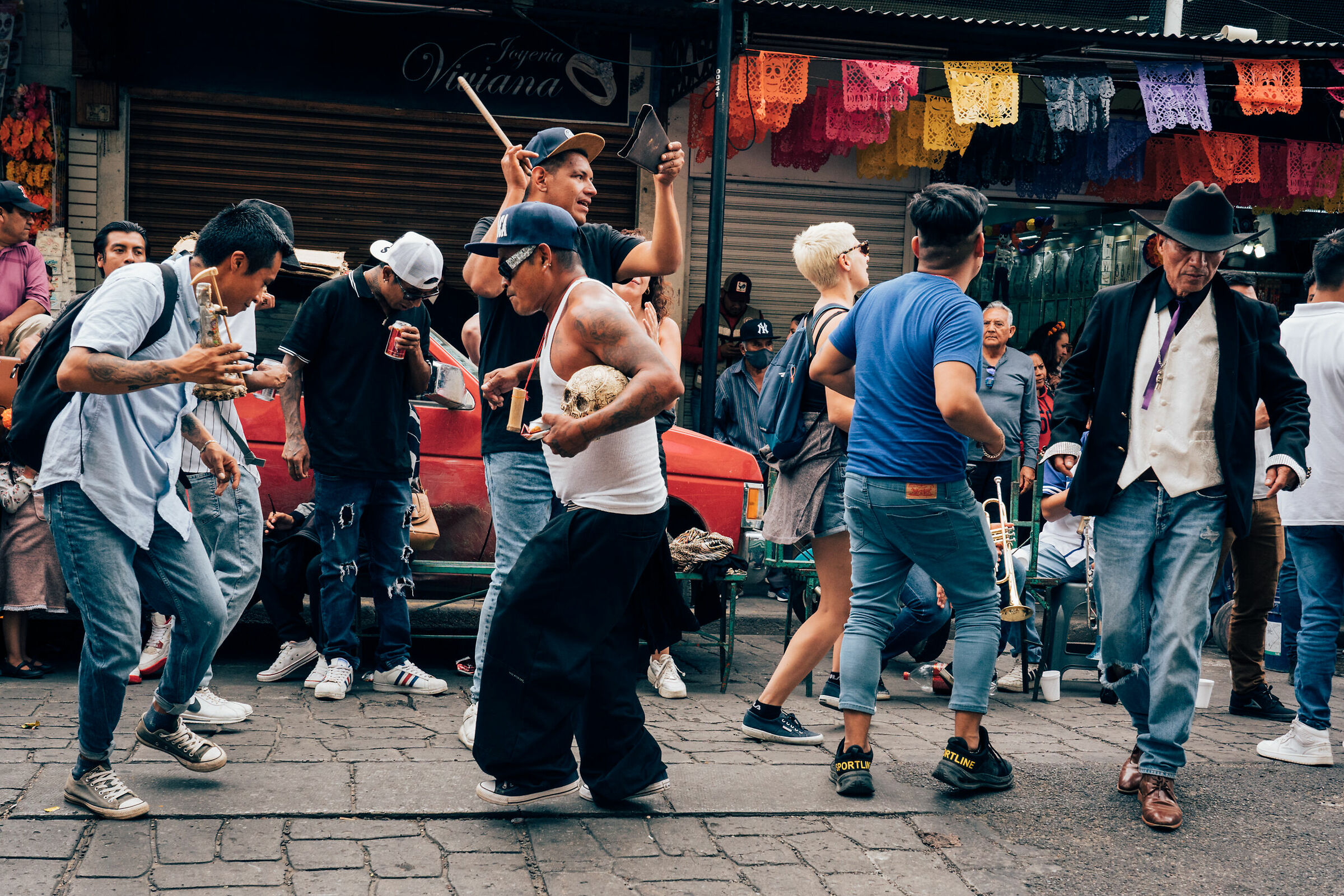 Dancing during a parade in a barrio in Oaxaca