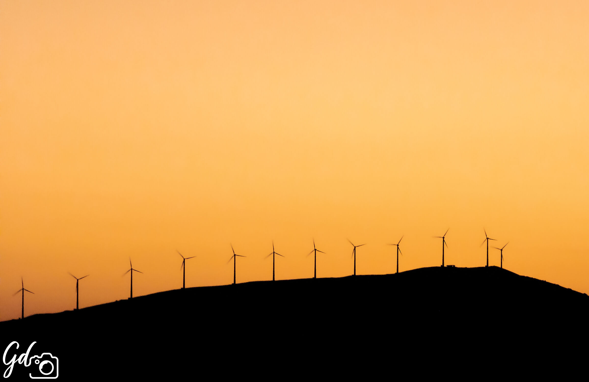 Wind turbines at sunset
