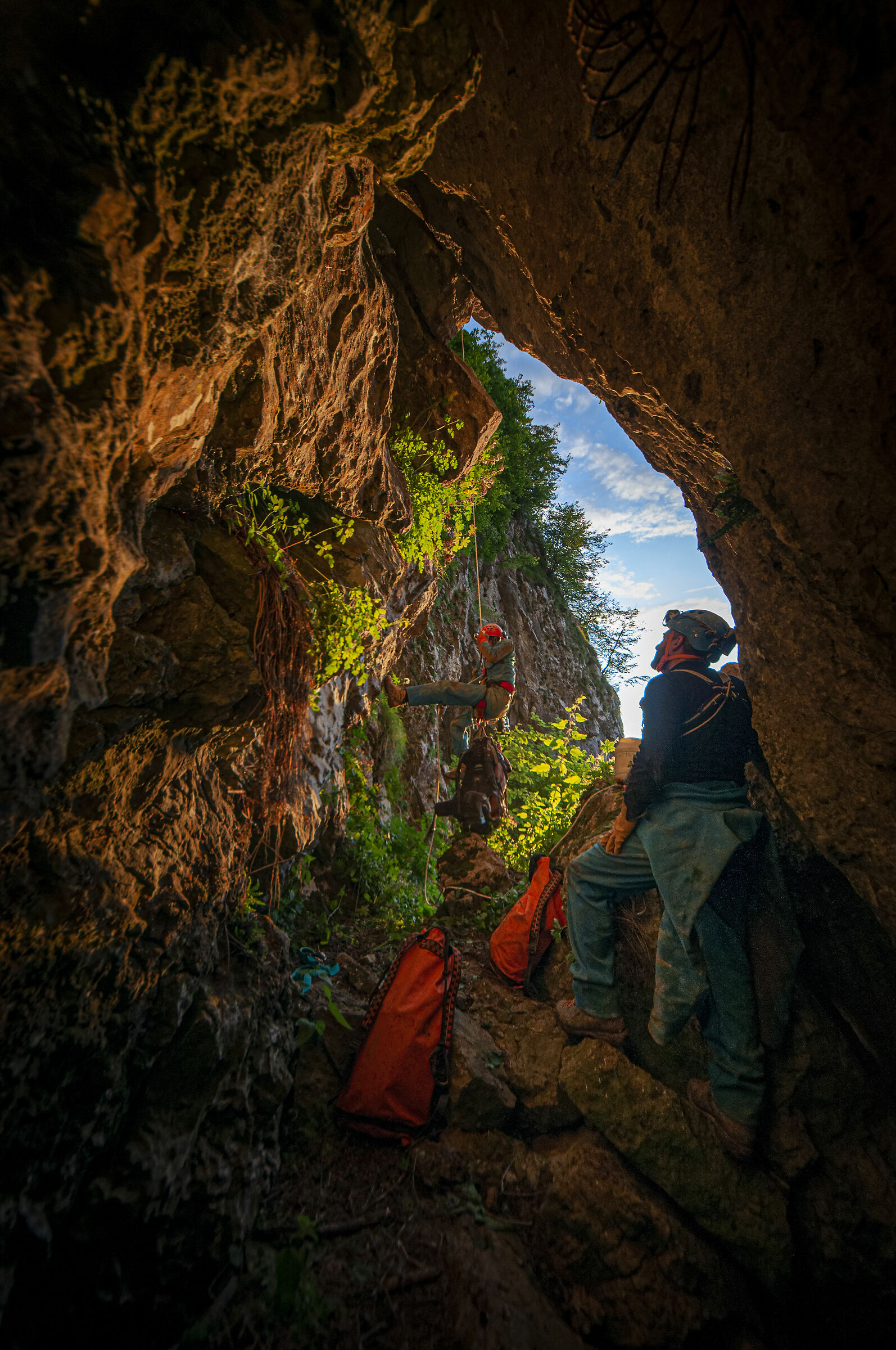 Improvviso - entrance with caver climbing out