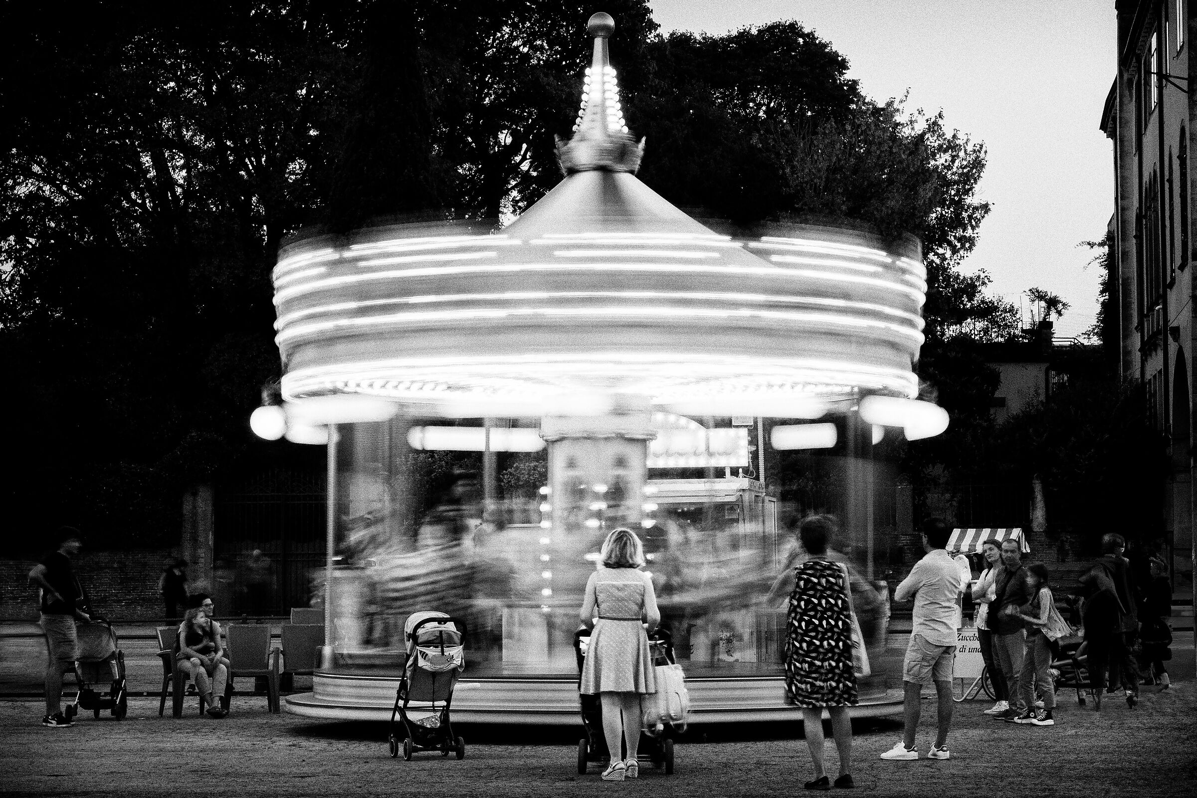 Three generations in front of the carousel