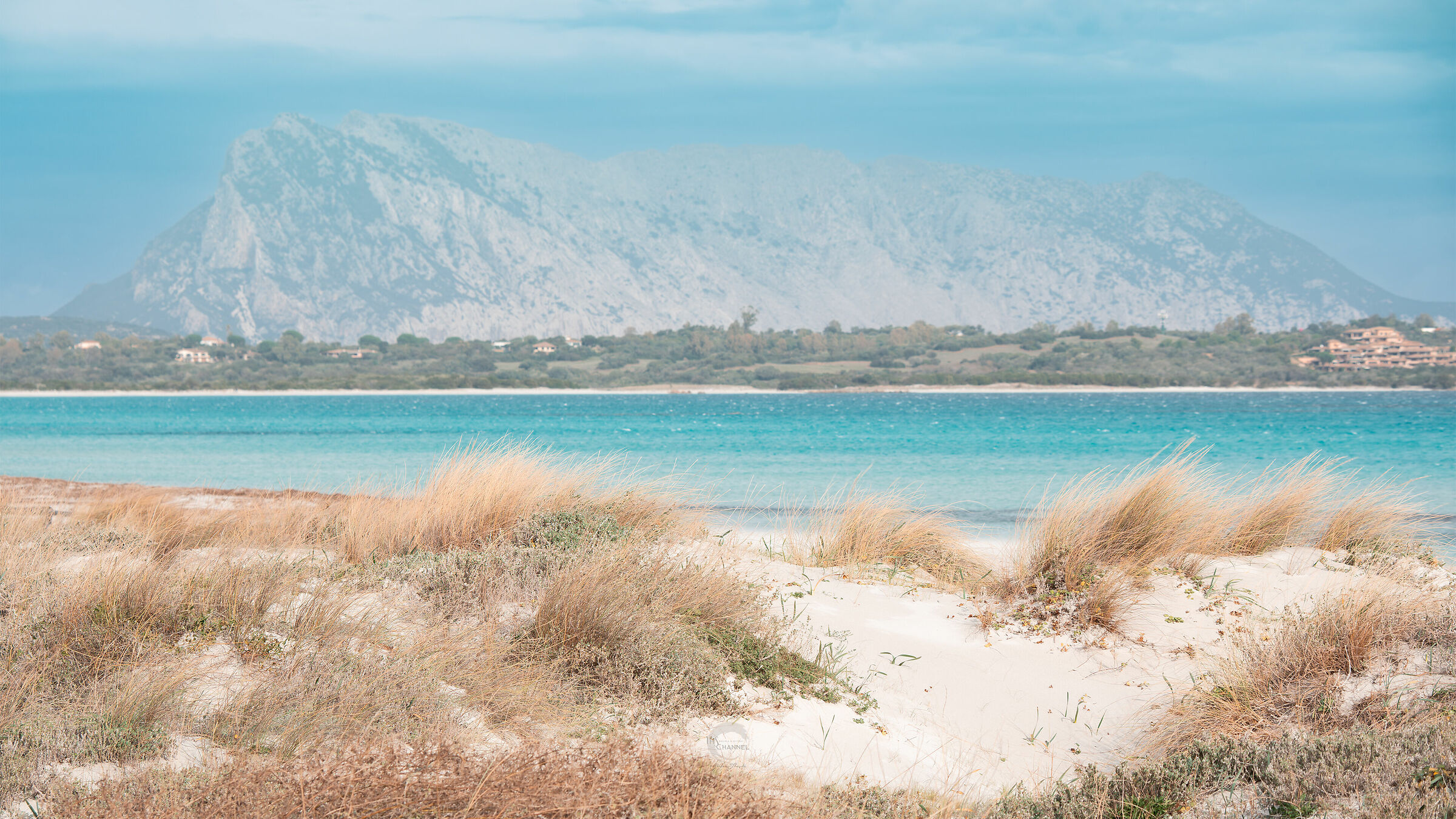 The grandeur of Tavolara from the Cinta beach