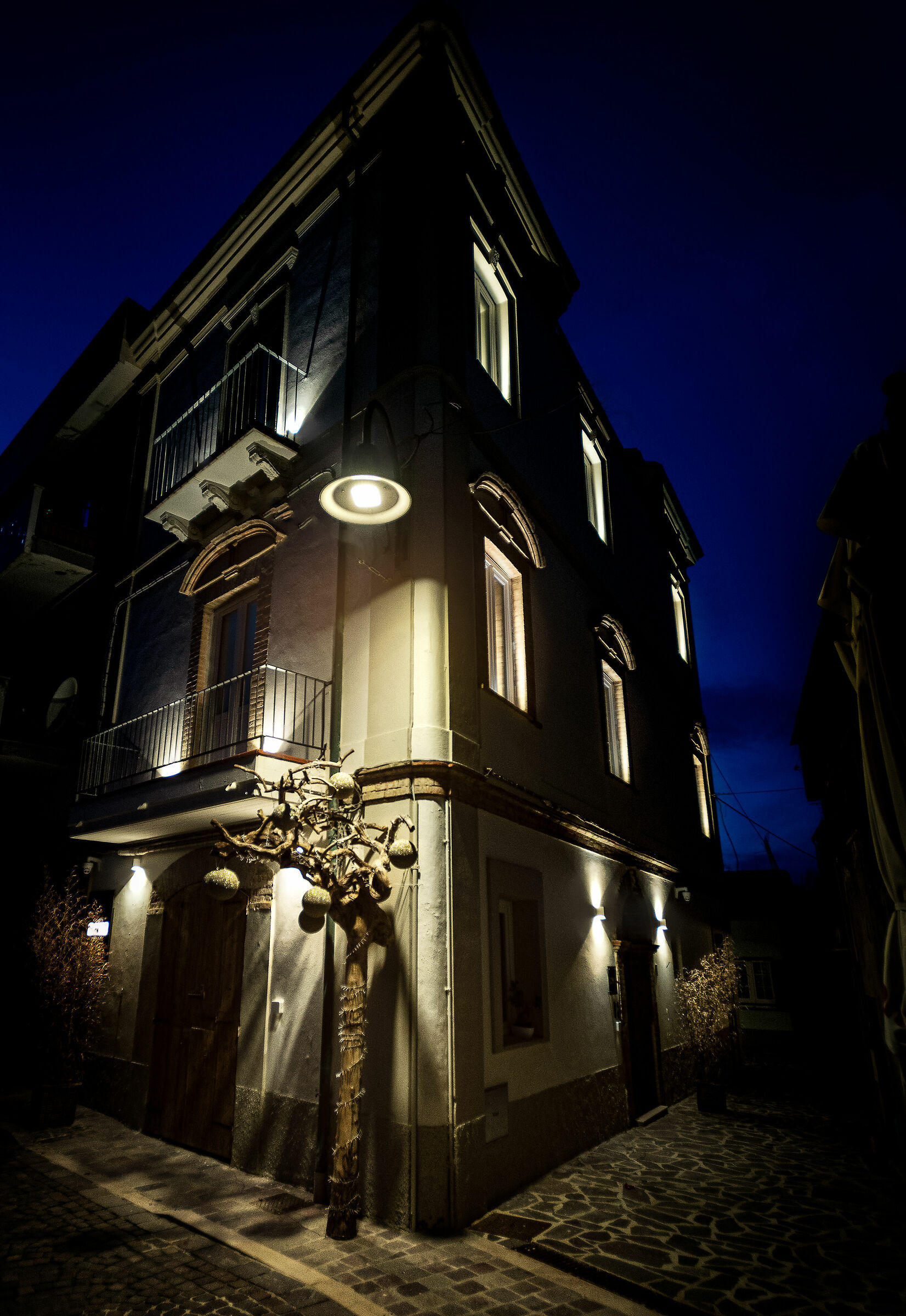 Lights and shadows run along the streets