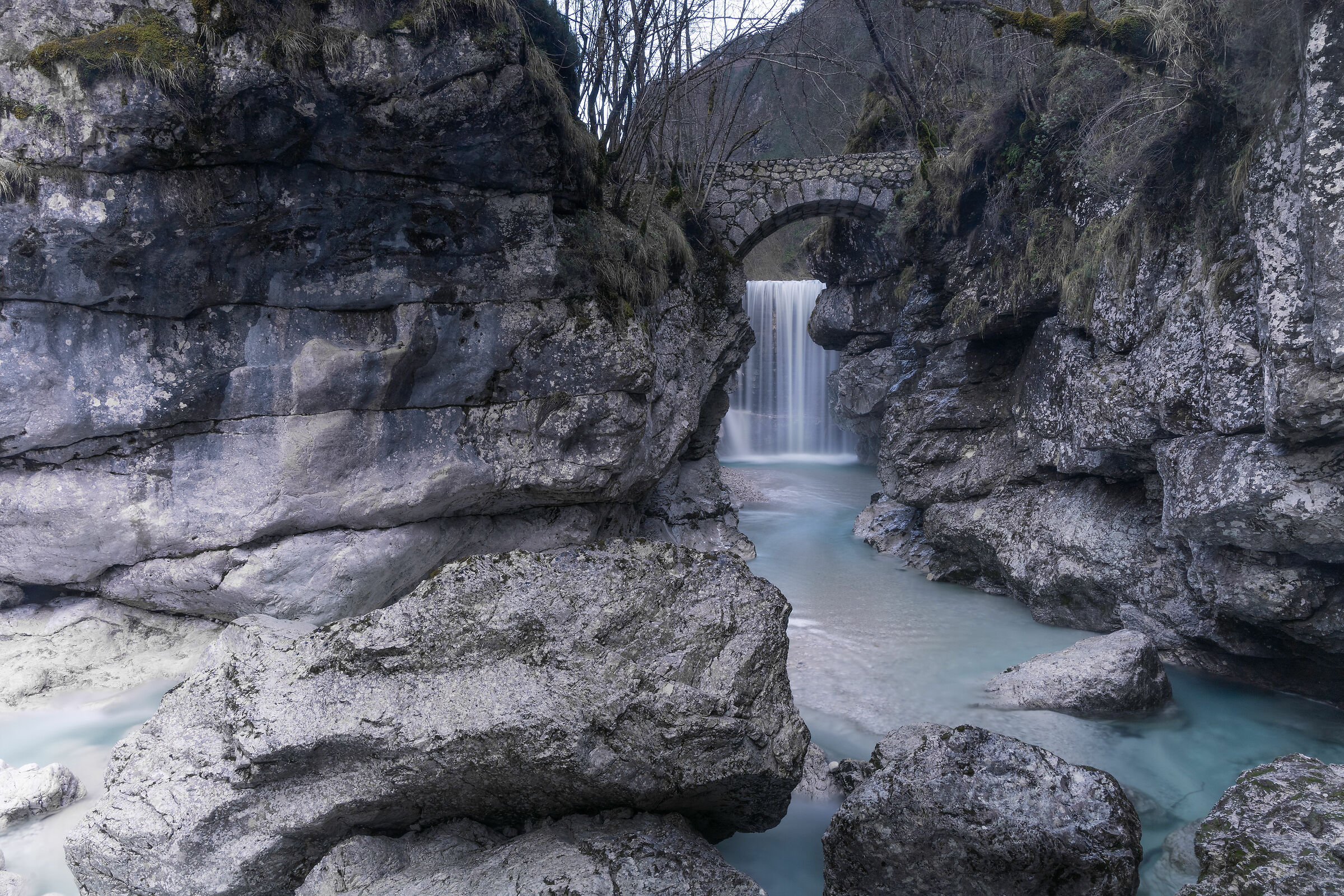 Roman bridge over the mountain stream