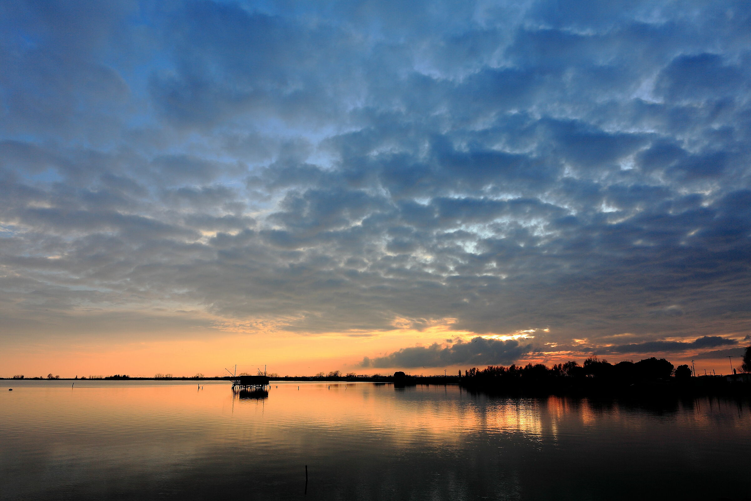 Si fa sera sulle valli di Comacchio...