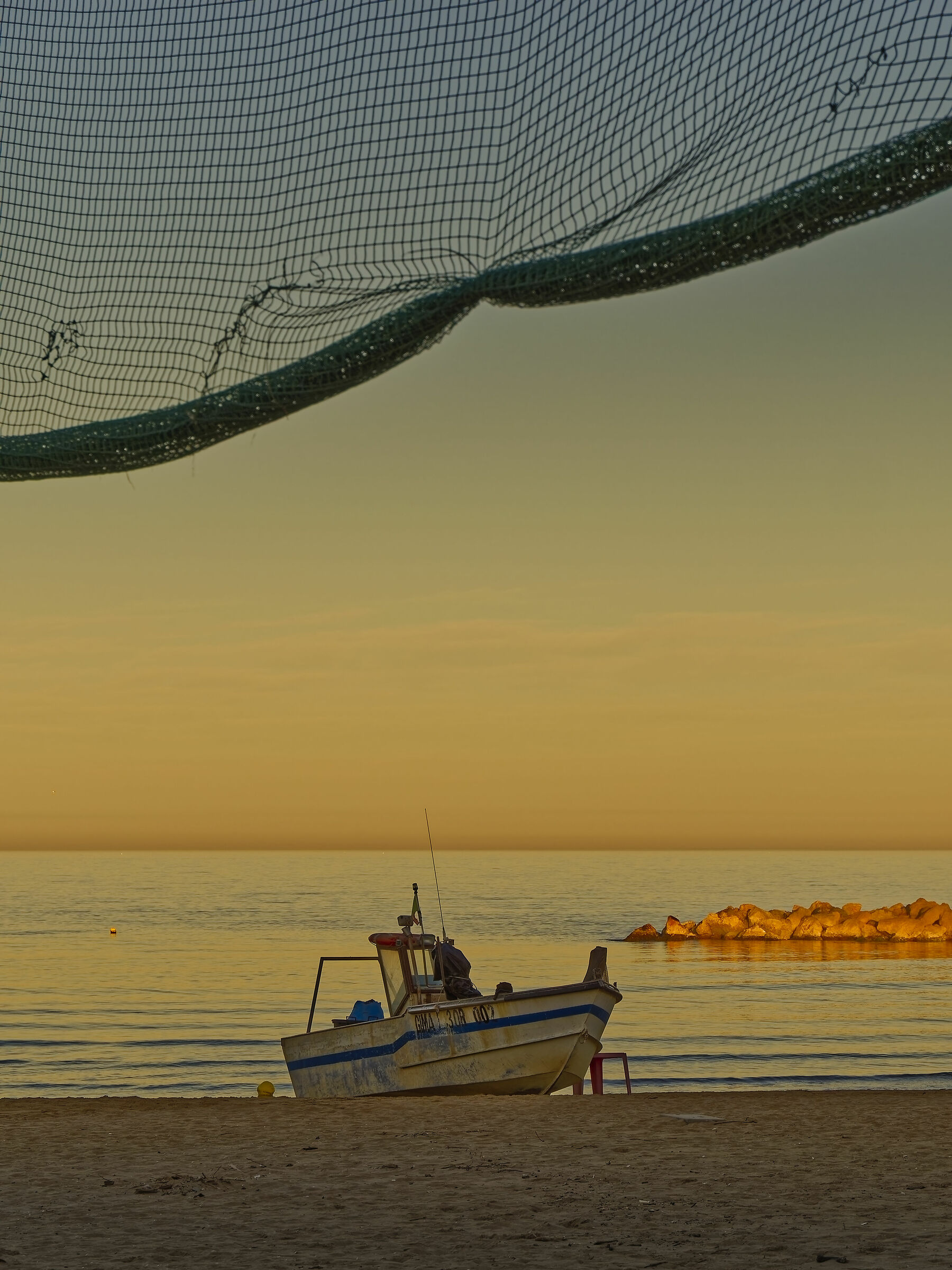 Fishing boat at sunset