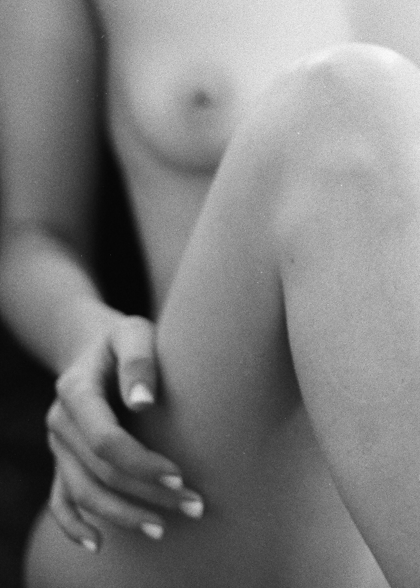 a blurry breast in a delicate gestures