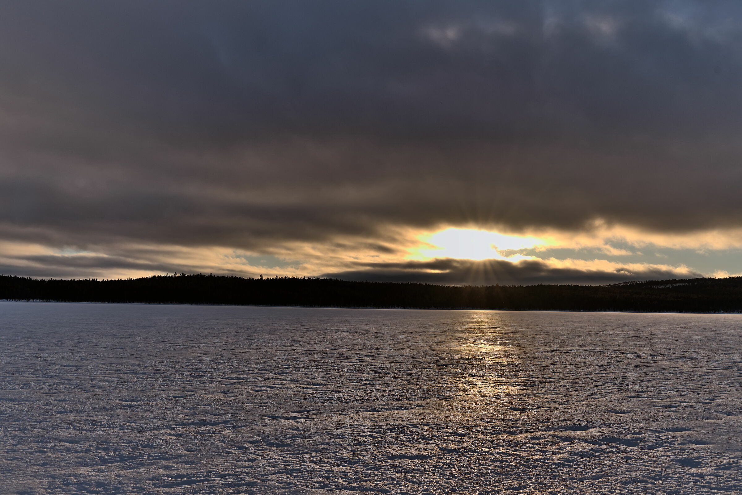 Sunset over the frozen lake