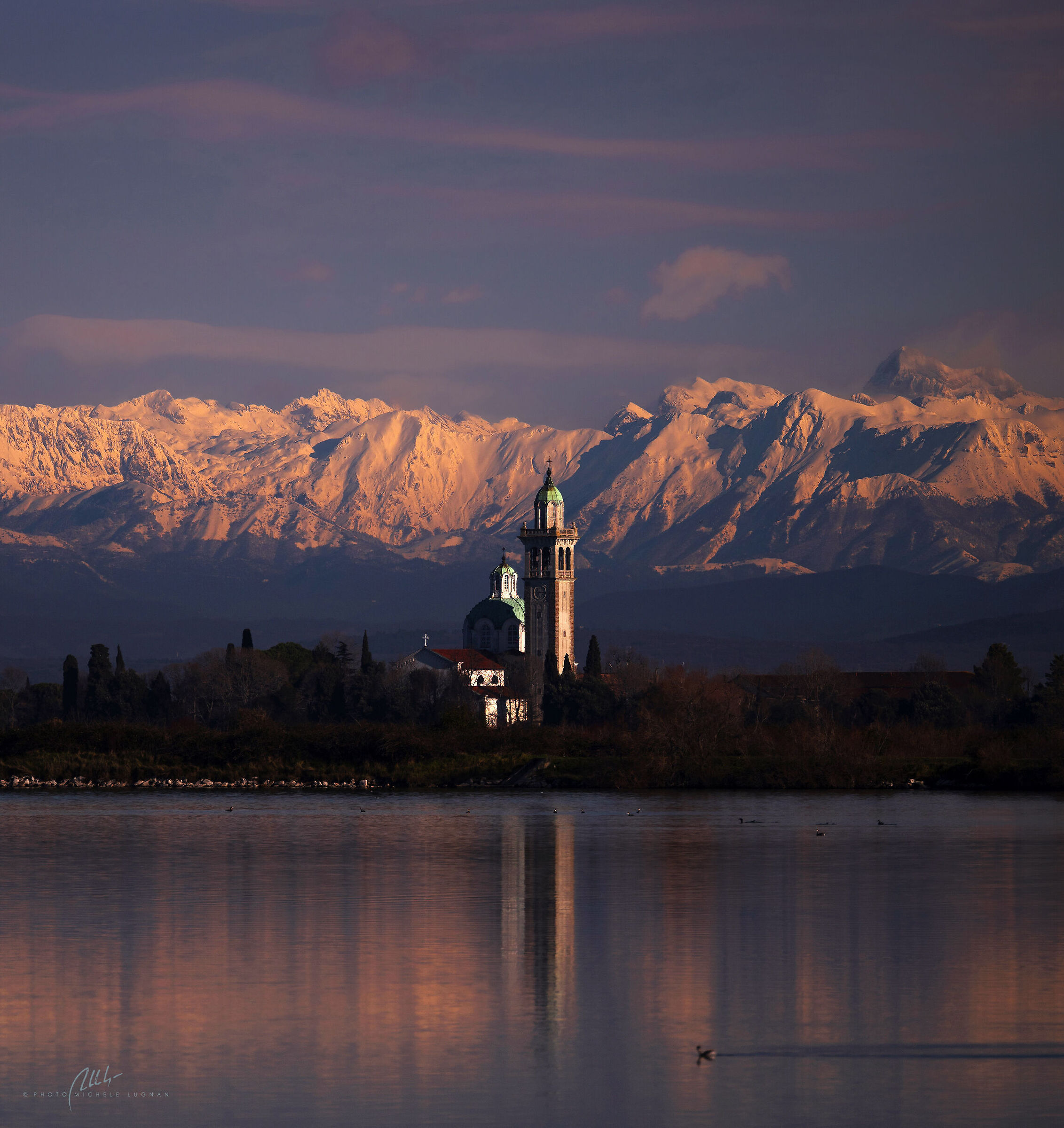 Lagoon sunset between Adria Sea and Alps