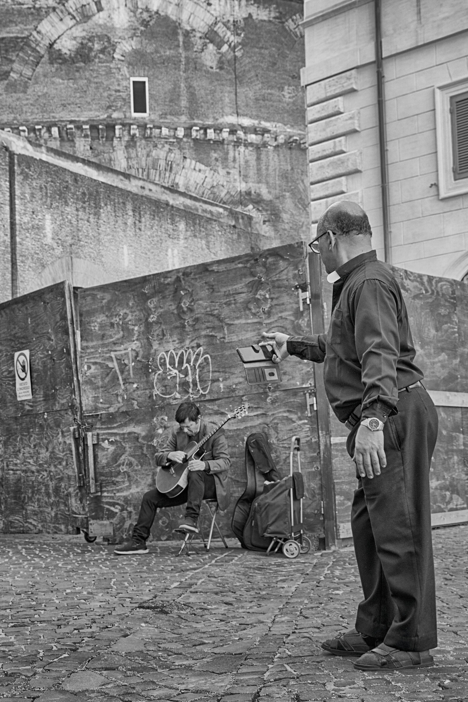 A priest and a busker - Rome 2024.