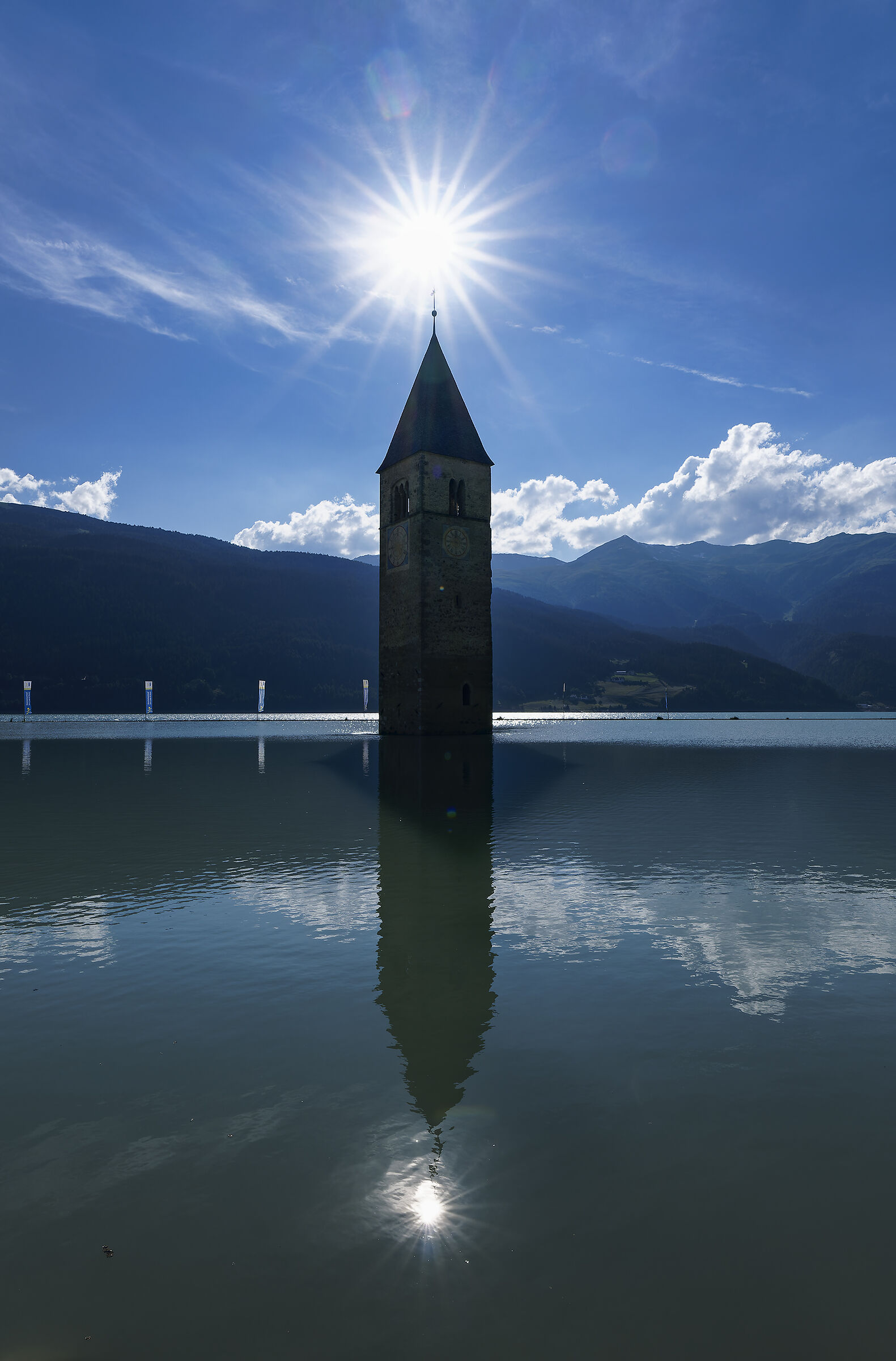Backlight on the bell tower of Lake Resia