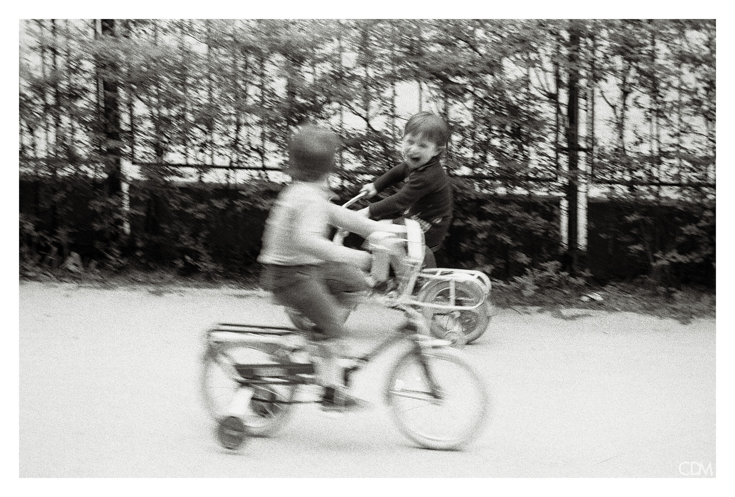 1975 On a bike, in the courtyard.