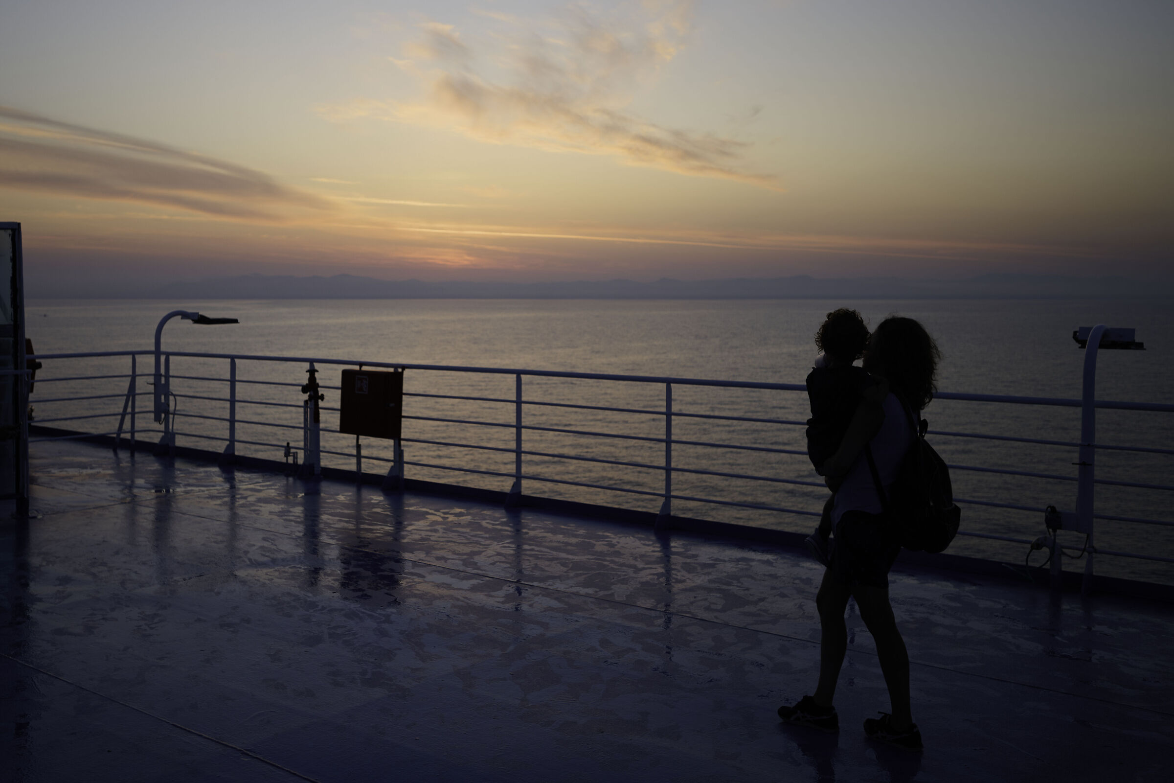 Mother and son await the dawn