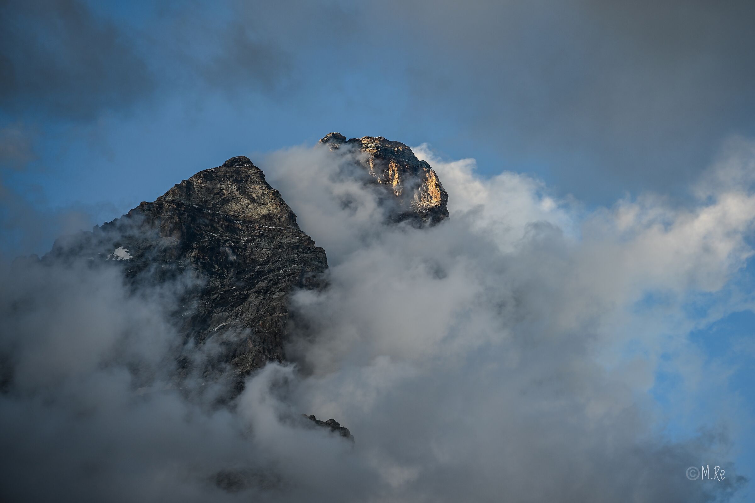 Summit of the Matterhorn in the clouds