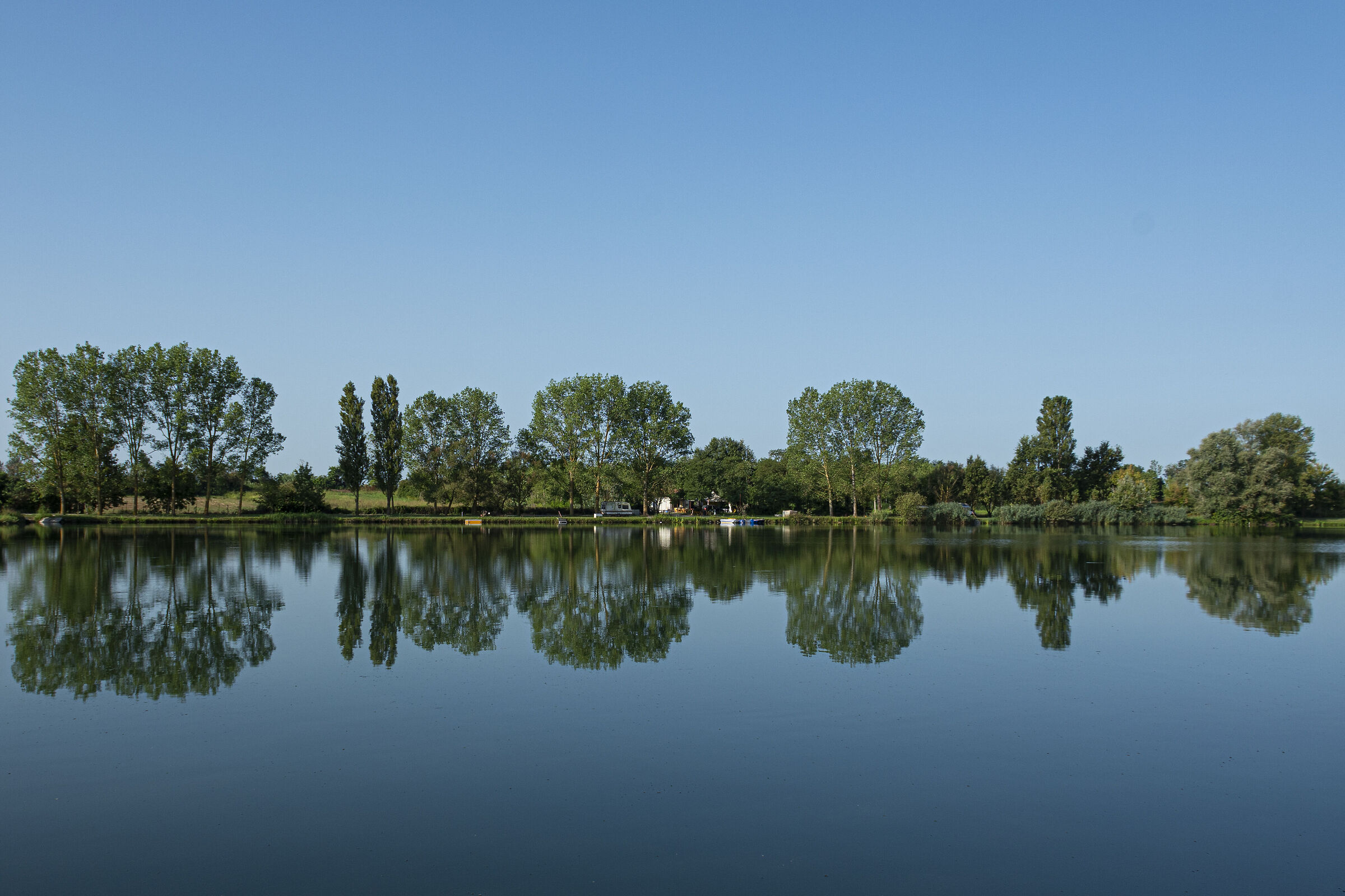 Cross-legged on the grass waiting for her