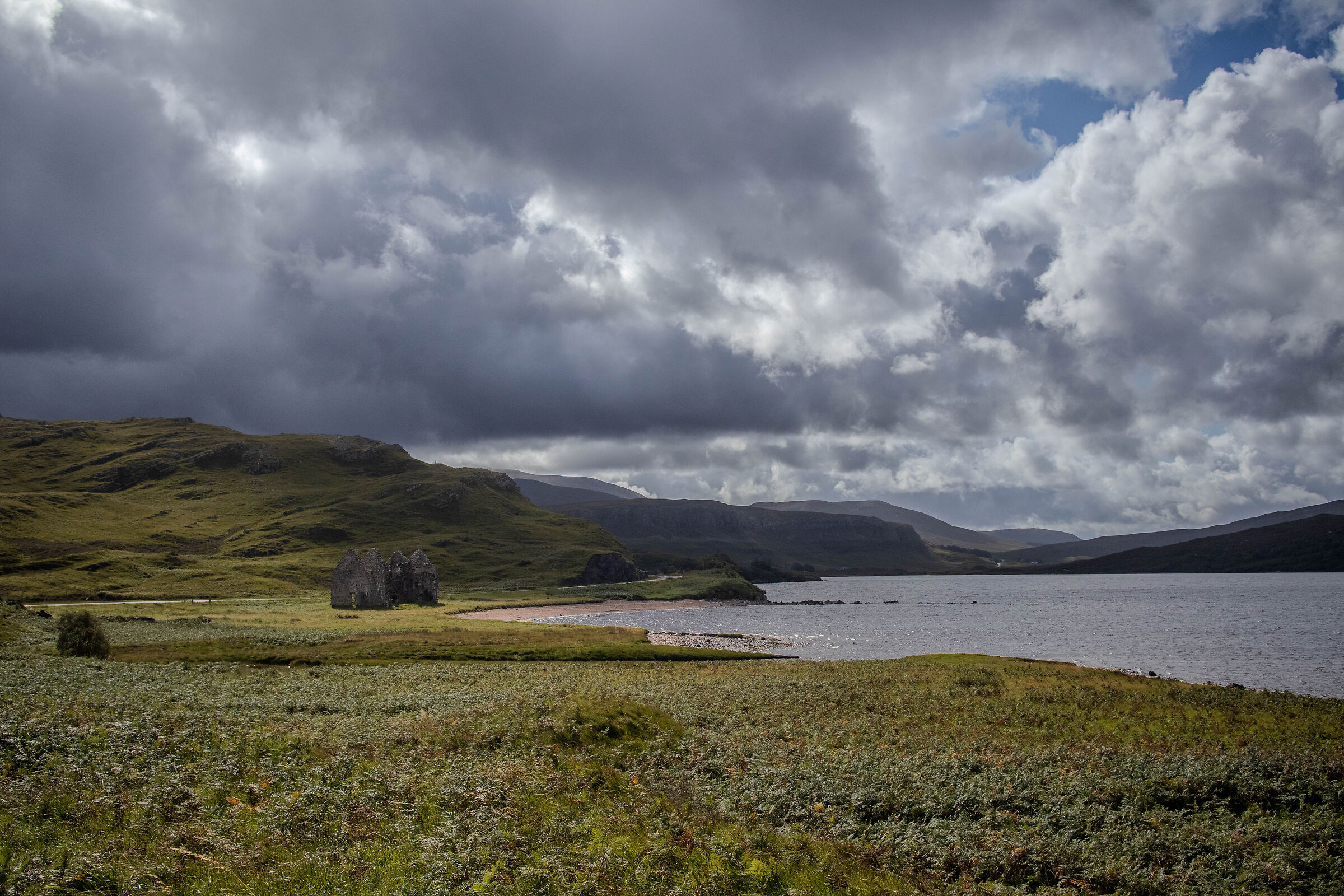 coastline with ruined house