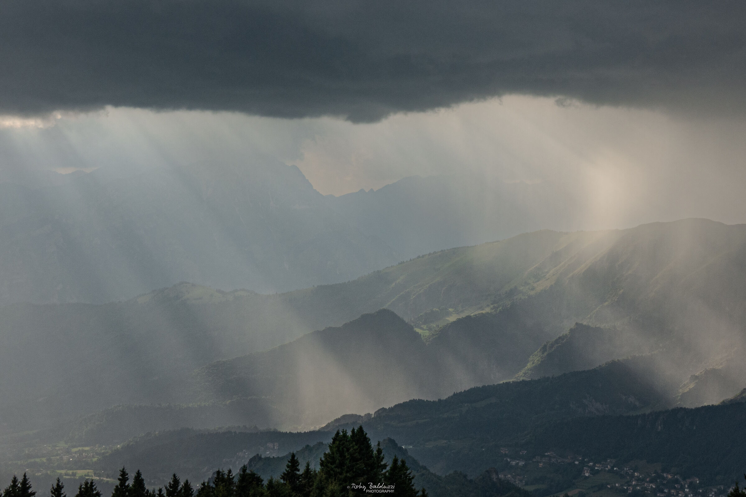 Beams of light in the clouds, before the storm
